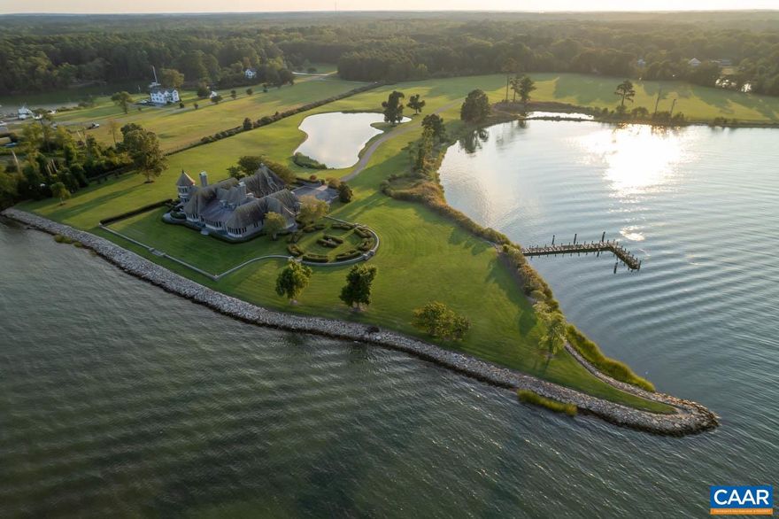 Avalon- Entering this grand estate you are transported into another world of magic and wonder. A truly extraordinary property facing the Chesapeake Bay sits on its own point with over 3,700+sf of Shoreline. A Tudor-Style home that echoes the likes of a Scottish Castle with fireplace mantels hovering over five feet, a gourmet kitchen, an AGA stove for hosting grand dinners, soaring exposed beam ceilings and intricate woodwork throughout create a true escape from the mundane. With high quality construction at every turn, this stone and stucco home, w/tile & copper roof, formal gardens, a whole house generator, 6 bedrooms, 6 full baths, 2 half baths, spacious closets, a large three car garage, and enormous finished attic space offers a truly exceptional experience. A bay side dock with deep water for watching the sunset with a glass of wine or setting sail for a day of adventure and an additional dock tucked into a sheltered cove with boat lift. This property is a fairytale.