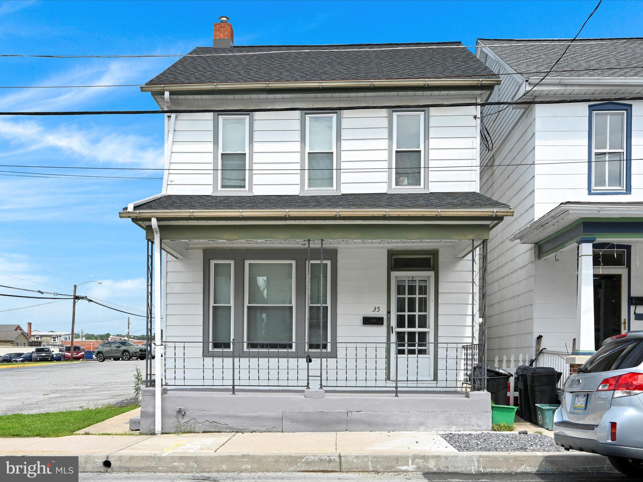Looking for a spacious home with great location and access to all that Elizabethtown has to offer? Check out this recently updated Colonial-style home, a perfect blend of traditional character and modern convenience. This 4-bedroom, 1.5-bath residence, renovated in 2024, offers a fresh canvas for your personal touch. The traditional floor plan features a spacious eat-in kitchen, complete with essential appliances including an electric oven/range and stainless steel refrigerator. With plenty of room you could add your personal touch with a full island and eat-in breakfast nook. This home features hardwood floors, tall windows, transom windows, and recently added mini-split systems to cool the home. The full, heated basement provides ample storage or potential for additional living space, while the main floor laundry adds to the home's practicality. Step outside to your rear yard, ideal for outdoor gatherings or quiet moments, and relax on the enclosed porch, soaking in the vibrant city views. Located in the heart of downtown, this property is just a stone's throw from a commuter rail station, making your daily commute a breeze. Explore local amenities, including shops, restaurants, and parks, all within walking distance. With a detached garage and off-street parking, convenience is at your fingertips. This home is not just a place to live; it's a lifestyle waiting to be embraced. Don't miss the opportunity to make this charming residence your own!