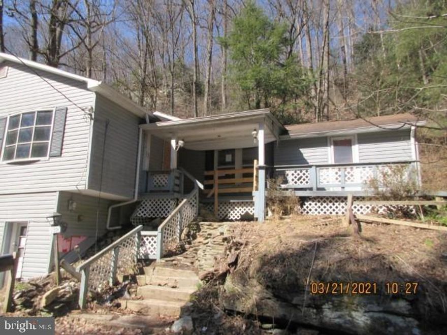 Auction Property.  Contact your agent to give a bid.  Home needs total renovation.  Not livable.  Most of the value in this property is in the land.  Peaceful setting w/possible in-law quarters.  3-4 bedrooms, 2 baths, off street and garage parking.  Home needs repairs from roof to mechanicals to total interior.