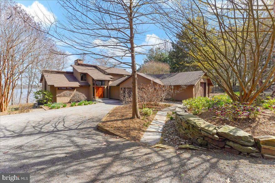 Waterfront! This stunning modernist gem is perfectly placed to frame the ever-changing views of Still Pond Creek and the surrounding woodlands. Invite the gang, because with 223 feet of shoreline, a sandy beach, a private pier, a heated indoor pool, an open floor plan with a big deck and 5 bedrooms, 3 ½ baths on 2.26 acres, there’s room for everyone and plenty to do! Sail, waterski, wakeboard, paddle, fish, or swim from the private dock with floating sections big enough for sunbathing or a crab feast. A short boat ride gets you to the Station Park Beach and the Chesapeake Bay! 4'+/- MLW (buyer to verify), high ground, not in flood plain.   
     Walls of glass, soaring ceilings, rich natural elements including massive mahogany beams, tongue & groove cedar ceilings, earthy terra cotta, and plenty of natural light feel like a warm hug from a home that loves you back. Indeed, this is the first time this home is available on the market since the owners built it. It's a wonderful way to live! The open spaces, private places, cozy nooks, and overlooks combine and flow to support both lively conversation and quiet concentration. Surround yourself with these timeless design features that bring nature in while providing complete comfort and privacy. This home has authentic Mid-Century-Modern provenance! It was custom designed for this site and this owner by the original esteemed Deck House Company (“The Eichler of the East”)  It was precision fabricated to custom specifications at the Deck House workshop in Acton, Massachusetts, and stick built with post and beam construction on site by a local builder in 1993.
     In addition to the 5 bedrooms (primary bedroom on main floor, two on upper, two on lower levels) there is a dedicated library/office on the main floor and on the lower level, there is a large sunlit studio with imported terra cotta tiles currently housing the owners looms and textile art.  The basement is partially above grade with windows and a ground level walk-out just a few steps to the pool house, stairs up to the deck, or down to the waterfront. It’s a very livable layout and quite versatile. The unfinished part of the basement has two large storage rooms and a huge workshop with a window toward Still Pond Creek.
     A short car ride brings you to historic Chestertown known for fabulous festivals, quaint shops & restaurants, artists’ studios, live theater, Washington College, a new nature center, bike trail, outdoor sculptures, and the Saturday farmers market! All of this within easy reach of major airports in Philadelphia, Baltimore, Washington.