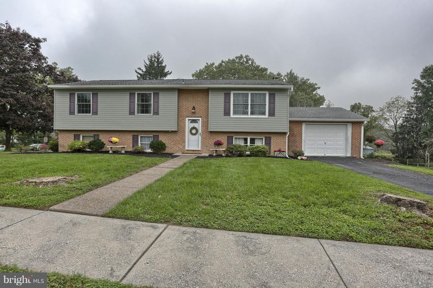 Welcome home to this sweet 3 bedroom, 2 bath Bi-Level home in Central Dauphin school district! Features include upgraded stair railing, stylish laminate hardwood flooring, some crown molding and high base molding, new carpet, updated kitchen with granite counters and stainless steel appliances. The expansive walk out lower level has a ship-lap wall, family room with a brick hearth fireplace with pellet stove insert, full bath, laundry room and another room that could be finished to make an additional 4th bedroom. All mechanicals were recently updated with a new heat pump, electrical panel, and hot water heater. On top of all of this there is an adjacent lot behind the home that is included in the sale to give plenty of privacy and outdoor enjoyment. Perfectly located in a desirable neighborhood and close to all amenities. Trust me when I tell you that this home won't disappoint! Put this one on your must see list.