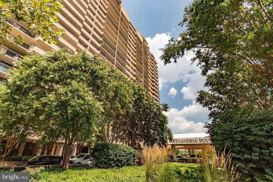 *OPEN HOUSE SUNDAY, 11/9, FROM 2:00-4:00PM* 2 bed, 2 bath Alexandria House condo with TWO assigned, garage parking spots (spots 96 & 97)! Fresh paint and brand new carpet in the bedrooms. Wrap around balcony with sliding door access from every room in the unit. Southeast city views along with a vantage point of sunrises and the Potomac River. Spacious living room with  hardwood floors and a separate dining room. Kitchen has pantry, stainless steel appliances, granite countertops, backsplash, shaker cabinets, and stackable washer/dryer. Primary ensuite has large walk-in closet and soaking tub. Second bedroom has two closets. Unit comes with a storage unit. All sliding glass doors have been replaced. Alexandria House boasts incredible amenities including: 24/7 front desk concierge, rooftop pool with sweeping views, gym, sauna, library, party room with kitchen, EV charging stations, community park, Amazon package delivery room, printing room, and the most helpful staff! Conveniently located near Harris Teeter, Trader Joes, coffee and restaurants, and trails. Easy access to DC, King St, metro stops, and DCA airport.