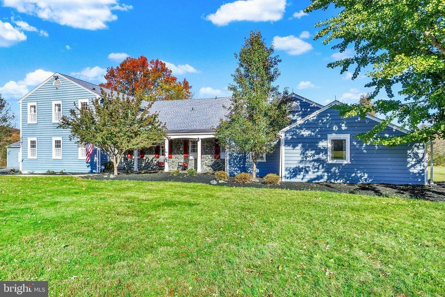 Welcome to this magnificent estate property for a true family compound life style with a full guest/in-law home and beautiful main home that offers a captivating Traditional Colonial style nestled on 3.68 acres of serene beauty with stunning mountain views! The main home has over 4,315 square feet of living space which is filled with old time character that meets modern amenities and upgrades including some updated bathrooms and fresh paint throughout! A private, tree-lined driveway sets the tone as you approach this timeless home with meticulous craftsmanship that has been lovingly cared for. Additionally, as you approach, the stone front covered porch leads you into the foyer with tiled floors, wainscotting and a spacious closet with organizers. A cozy office or library space offers built-ins, crown molding, chair rail and hardwood floors, a truly a regal space. Make your way to the eat-in kitchen which is the heart of the home featuring Corian countertops, an oversized island with prep sink, recessed lighting, built in pantry with pull outs and built ins, new dishwasher, brand new 48-inch gas range with 8 burners/dual ovens. Gather in the family room with coffered wood ceiling, floor to ceiling stone fireplace with wood stove insert and wood storage area, built in cabinets and patio access, or host guests in the elegant formal dining room with crown molding and chair railing with wainscotting. The living room radiates warmth with its wood stove fireplace, hardwood floors and French doors leading to the lovely sunroom. Main level laundry with built-ins, double utility sink, large closet with shelving and a laundry chute. Two bonus rooms on the main level offering a playroom or exercise space. Large mudroom area with hooks and closet for storage, along with access to the outdoors. Upstairs, you will find four spacious bedrooms, including a primary suite with dual closets (one of which contains a safe), and an ensuite bath with double vanities. One of the bedrooms upstairs offers a full bath, built-in, window seat and double closets. Dual access to the oversized basement for storage with built in shelves. The detached oversized tandem style garage featuring two car up front and a third bay in the back offers a workshop complete with heat and electric. The guest home is 2,145 square feet with 4 bedrooms with hardwood floors, 3 full bathrooms, spacious great room featuring deck access overlooking the mountains. A one car garage accompanies the guest home. Outdoors, the property shines with incredible additional amenities including an 8-stall goat or pony barn with a hay loft, water and electric; a separate fenced space for corralling your animals. This extraordinary property offers a blend of classic architecture, functional spaces, and endless opportunities. Dual Zoned Geothermal for optimal efficiency. Seller willing to do a pre-settlement lease back for anyone needing school enrollment accommodations.  Conveniently located to shopping, dining and entertainment. Truly one of a kind! A joy to own!