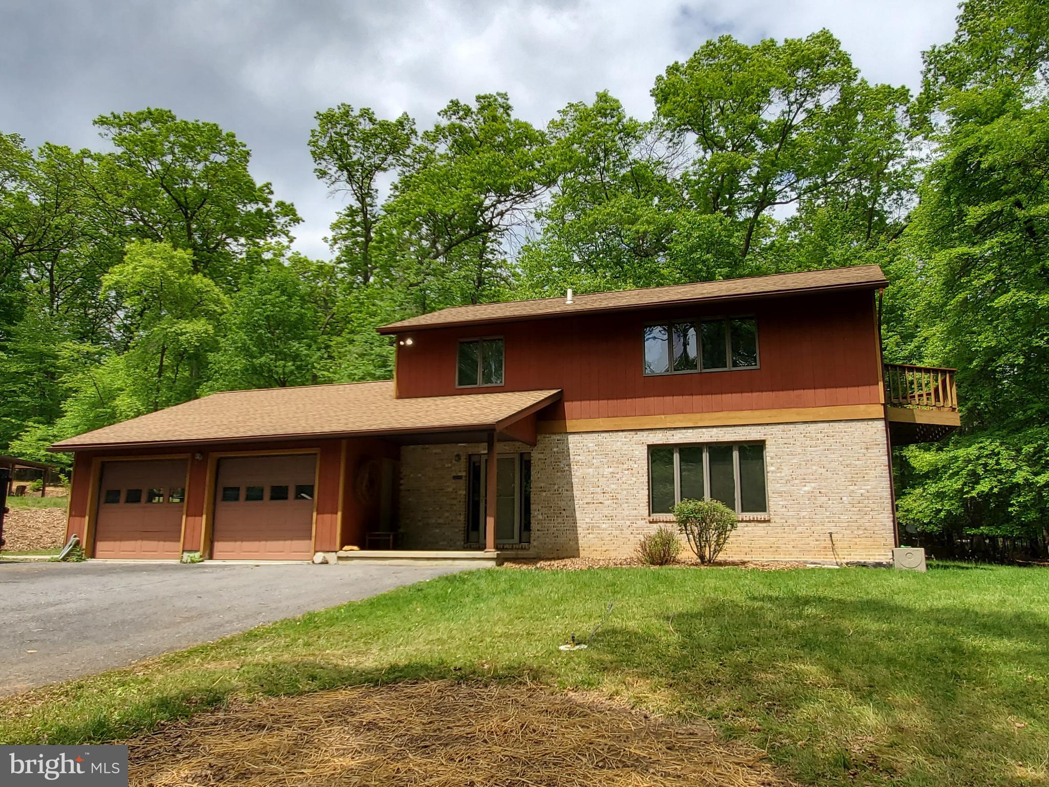 Enjoy the peaceful and private setting of this 2 story home in Oley Valley Schools. This home is nestled on 4.75 acres with plenty of space to roam and enjoy nature.  This 4 bedrooms, 2 1/2 bath home featuring hardwood and ceramic tile floors. Large eat-in kitchen with granite countertops includes range, refrigerator, microwave, dishwasher and refrigerator. The main level laundry includes a washer and dryer for your use. Family room features a wood stove and sliding door opening to patio. Plenty of storage space in the basement and large two car attached garage. Tenant is responsible for all utilities, lawn and snow removal. The yurt and retreat center are not included with the home rental. An application with credit and background check are required, tenant(s) must have an average or above credit rating. Notice: Landlord has a no pet policy!