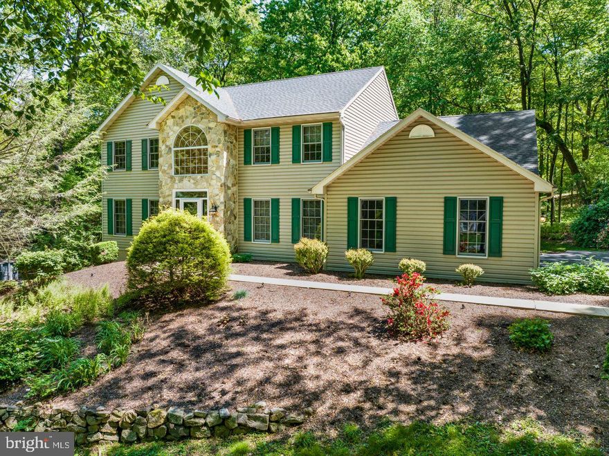 Nestled on a cul-de-sac within the desirable Forest Ridge community, this charming custom 4 bedrooms, 3 full baths, Colonial offers a serene retreat on a picturesque, wooded lot. Step inside and be greeted by a grand two-story foyer, showcasing extensive decorative molding and elegant wood flooring that sets a tone of sophisticated style.
The formal dining room, perfect for entertaining, boasts gleaming hardwood floors, classic wainscoting, and a generously sized walk-in pantry. Adjacent to the foyer, a versatile front room with plush carpeting can serve as a formal living area or a home office.
The heart of the home lies in the eat-in kitchen, featuring custom cherry cabinetry, accented by 36 handles, durable Granite countertops, and stylish tile backsplash. Equipped with a double bowl sink, a convenient convection self-cleaning gas oven, a second pantry, and recessed lighting, this kitchen is both beautiful and functional. Seamlessly connected, the tile flooring flows from the foyer into this inviting space. A conveniently located first-floor full bathroom with a stand-up shower adds practicality, along with a large laundry room offering direct access to the two-car side-entry garage and built-in closet.
Relax and unwind in the inviting family room, highlighted by a custom-made built-in cabinets and bookshelves, a cozy gas fireplace, and elegant French doors that lead to outdoor enjoyment.
Ascend to the second floor where the luxurious master suite awaits. This private oasis features a vaulted ceiling, a sitting room thoughtfully converted into a spacious walk-in closet that leads to the 2nd walk-in closet providing ample storage. The private master bathroom offers a relaxing jet tub and stand-up shower. Three additional well-appointed bedrooms and a full bathroom complete the second floor.
The finished walkout basement is an exciting bonus, offering even more living space with a dedicated fitness room and a separate, expansive entertainment room featuring a built-in bar with Granite countertops, seating for 7, built-in shelves and speakers.
Extend your living outdoors via the two-tiered deck accessible from the family room, where a hot tub awaits amidst the tranquility of the wooded backdrop and stone walkway.
This exceptional home offers 1st floor 9ft ceilings, abundant storage throughout, including numerous closets, dedicated utility room and new roof installed in Jan 2023. Enjoy the comfort of central air conditioning, efficient propane-fueled forced hot air, and the convenience of an on-site well and septic system on 1.12 acres. This Forest Ridge gem is more than just a house; it's a place to call home.