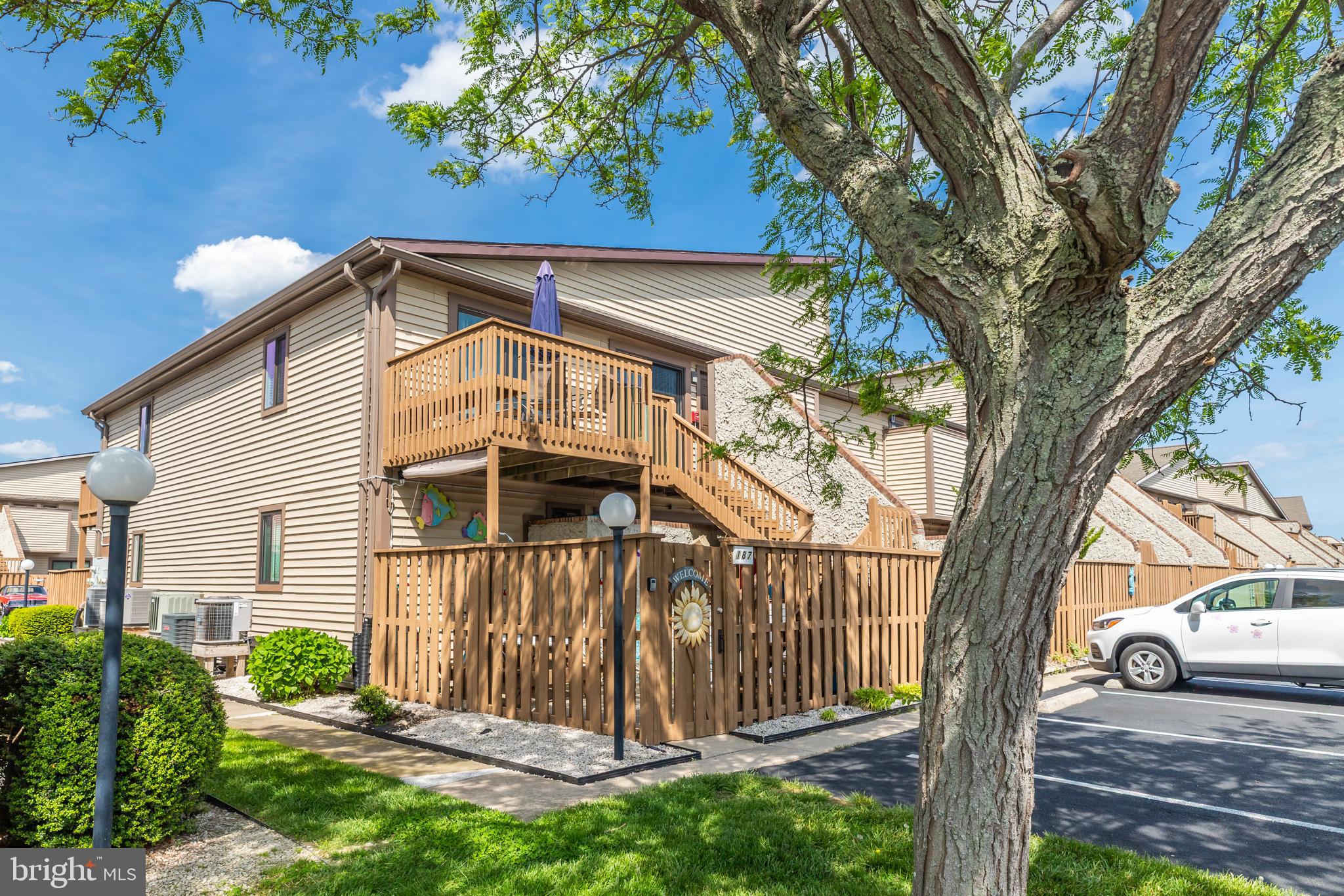 This beautiful end unit, including a deeded boat slip, features a new HVAC system installed in 2023 and new sliders. The layout includes a combined kitchen and dining area, leading into a spacious living area.
The private owner's suite is furnished with a king bed and includes a full bath. The second bedroom is equipped with a queen and a full-size bed. A full bath across the hall features a large garden tub and a separate walk-in shower. For added convenience, there is a stackable washer/dryer in the unit.
Relax and enjoy the outdoors on the upper deck or in the lower fenced area, complete with a picnic table and chairs. Lighted stairs ensure your safety at night. The property is a short walk to the beach, as well as various restaurants, grocery stores, a pharmacy, and retail stores. It is also located near Northside Park.
Additional amenities include access to an indoor heated pool and tennis courts. This unit comes with a deeded boat slip #28.
Call today with any questions or to schedule a showing