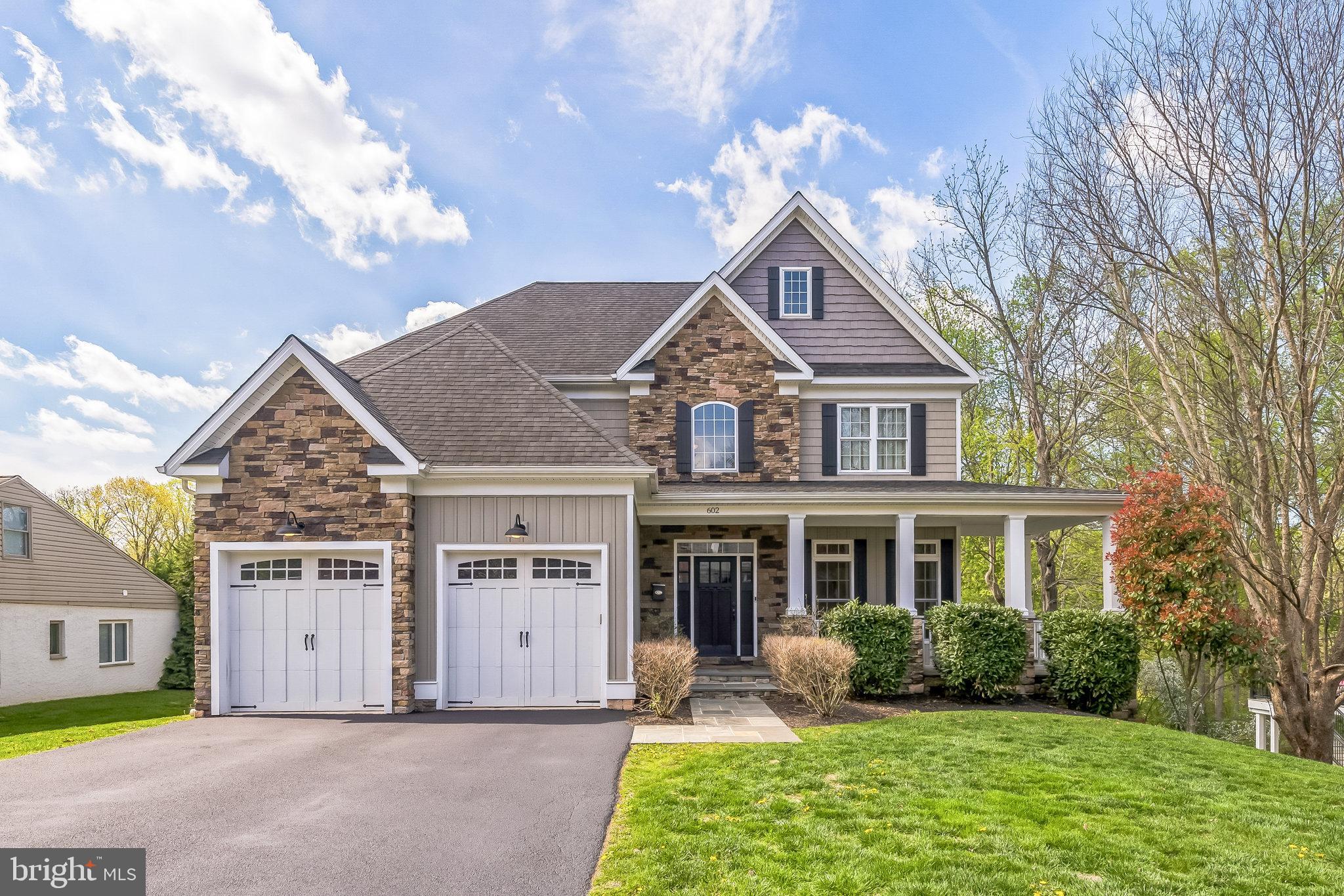 Welcome to 602 Rose Hill Rd, a stunning custom-built home nestled in the heart of Marple Township. Built in 2017, this exquisite 4-bedroom, 2 full and 2 half bath home offers 2,688 square feet of beautifully designed living space on a spacious and private lot. From the moment you arrive, the gorgeous stone veneer façade, Carolina beaded siding, and flagstone wraparound porch set the tone for quality craftsmanship and timeless charm. Step through the front door into a bright and welcoming two-story foyer with 8-inch hickory-stained hardwood floors flowing throughout the main level. To the right, a sunlit study provides the perfect space for a home office or quiet retreat. To the left, a hallway leads to the oversized 2-car garage and a stylish half bath, offering both convenience and function. The heart of the home is the open family room featuring 9-foot ceilings, a cozy gas fireplace, and large windows that flood the space with natural light. Sliding glass doors open to the rear Wolf deck with vinyl railings, offering an ideal space for entertaining and overlooking a vast, tree-lined backyard—your personal oasis. The gourmet kitchen is a chef’s dream, featuring off-white Craftsman-style cabinetry, granite countertops, a glass tile backsplash, and top-of-the-line stainless steel appliances, including a 48-inch dual-fuel range. A center island with built-in microwave and wine chiller provides additional seating and prep space, perfect for family gatherings and entertaining. Adjacent to the kitchen, the formal dining room shines with coffered ceilings, recessed lighting, and elegant wainscoting—a warm and inviting space to host holidays and special occasions. Downstairs, the finished basement offers the ultimate hangout spot, complete with a custom bar, quartzite countertops, wine fridge, half bath, and walk-out access to the backyard. This versatile space is perfect for game day, movie nights, or casual entertaining. Upstairs, the luxurious primary suite includes a tray ceiling with recessed lighting, a walk-in closet, and a spa-inspired bathroom with maple tile, frameless glass shower, soaking tub, and dual vanities. Three additional bedrooms offer plush carpeting, ample closet space, and easy access to a full center hall bathroom with double sinks. The second-floor laundry room adds everyday convenience.
Additional features include: 2-zone propane gas heat and central air (propane tank is owned), vinyl windows throughout, and a location that offers the perfect blend of privacy and accessibility. Just minutes from local shopping, dining, major highways, and public transportation, this home combines luxury and location with ease. Don’t miss your chance to own this one-of-a-kind home in one of Delaware County’s most desirable neighborhoods. Schedule your private showing today!