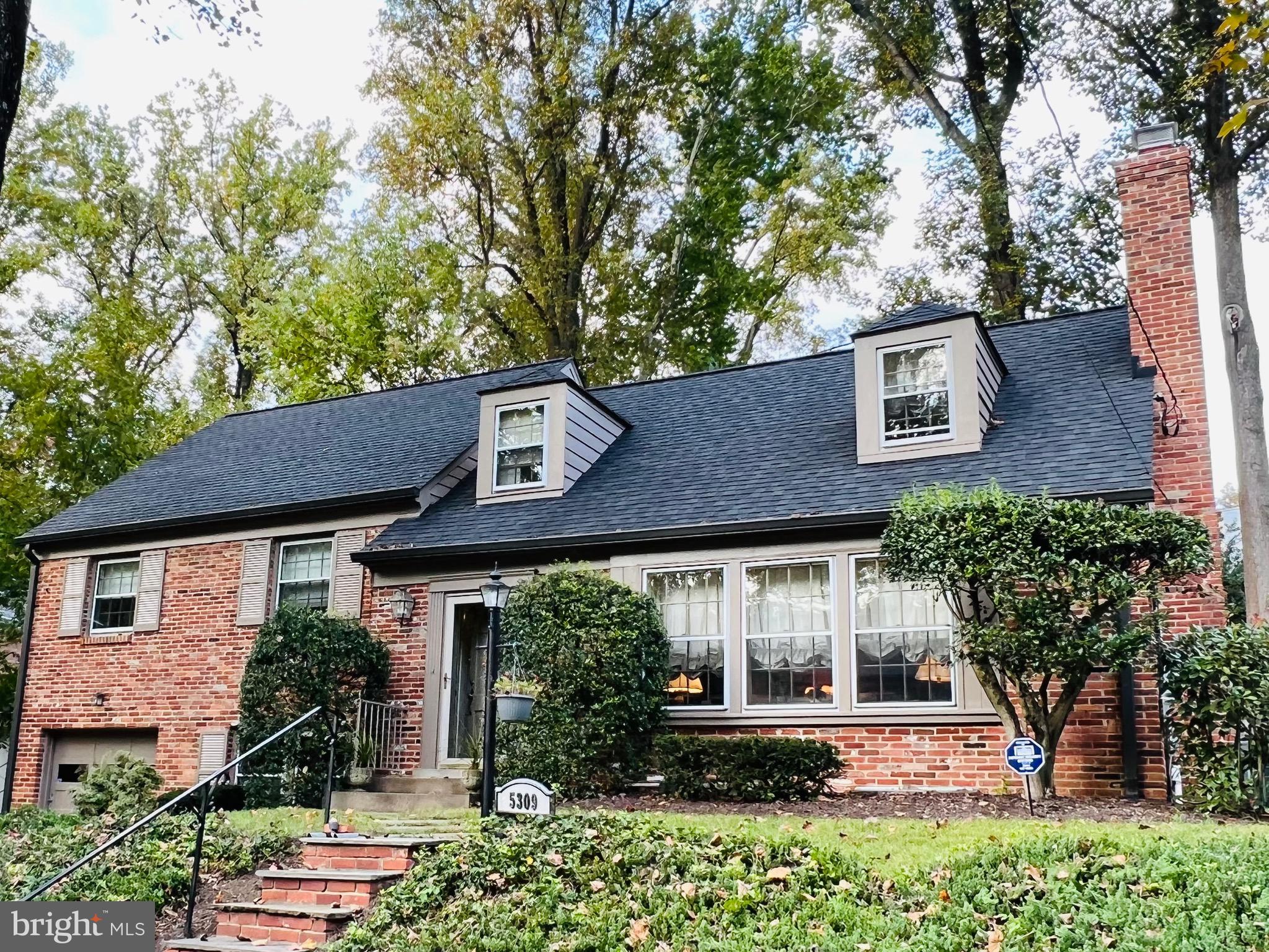 ENTERED FOR COMP PURPOSES ONLY - Welcome to this charming four bedroom, two-and-one-half bath split level home nestled in the highly sought-after Westmoreland Hills neighborhood of Bethesda. With a flagstone walkway that leads into this spacious and sun-filled home, coming home is a delight. The traditional floor plan includes a foyer, large living room with fireplace, dining room, and kitchen. The eat-in kitchen overlooks the verdant backyard and seamlessly connects to the dining room, creating excellent flow. From the dining room, one can step out onto the rear patio featuring a built-in brick fireplace. The home also includes a separate family room and a convenient powder room. On the second floor is the primary bedroom with vaulted ceilings, an en suite full bath featuring dual sinks and a separate tub, as well as a walk-in closet. Completing the second floor are three additional bedrooms and a full hall bath.
The lower-level recreation room features a bar and built-ins, and there is also a laundry area with laundry sinks and a storage room. Other notable features include an attached one-car garage, a private driveway, and a third-level floored attic with a vaulted ceiling, offering an excellent opportunity to expand in the future.
This tranquil home is conveniently located close to Spring Valley shops and restaurants, the Metro, downtown DC, and Bethesda. The Westbrook, Westland, and B-CC schools serve the neighborhood.