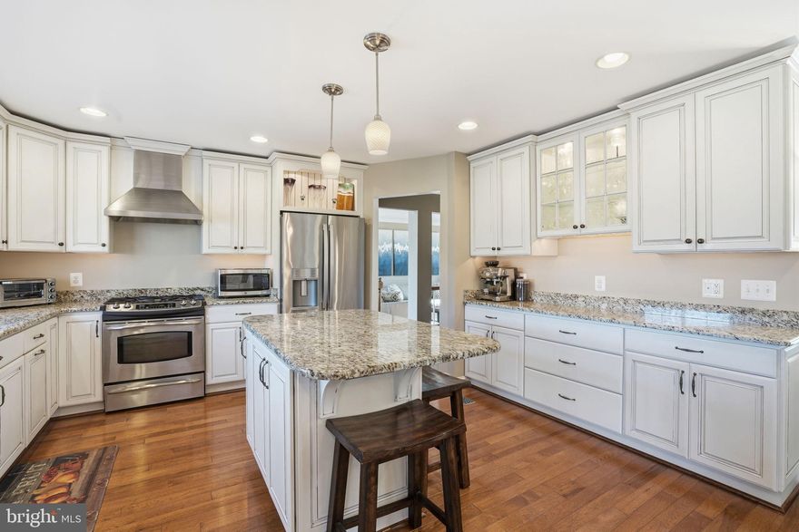 Experience refined living in this stately four-bedroom, 2 full and-2-half-bath colonial residence, impeccably maintained and enhanced with substantial, high-quality upgrades throughout. Designed for both elegant entertaining and everyday comfort, the home opens to a private outdoor sanctuary featuring an expansive poured concrete patio with fire pit, and a NEW composite deck complete with drink rail, integrated step lighting, and built-in entertainment system (2023). This exceptional setting offers a seamless extension of the home’s living space.
The current owner has thoughtfully completed all major capital improvements, allowing for a truly turnkey experience. Notable enhancements include new windows in the family room and kitchen (2024), new ceiling fans in all four generously sized bedrooms (2020), a smart garage door opener (2017), a NEW high-efficiency two-stage furnace and air conditioning system (2023), and a NEW water heater (2024). Additional upgrades include hardwood flooring throughout the entire main level (2020), a custom stainless steel chimney chase with a beautifully refinished fireplace (2022), and a newly resealed driveway with updated mailbox (2025).
The expansive, level lot was professionally cleared and graded, with a perimeter of mature Arborvitae providing a lush and private backdrop (2019). The kitchen is supported by NEW appliances, including a refrigerator (2023) and dishwasher (2024), with two additional refrigerators conveniently located in the lower level for extended storage.
The fully finished lower level offers exceptional versatility, featuring a spacious recreation area, bonus rooms, and a full bath — ideal for entertaining or multi-functional living. While many homes promise luxury, this distinguished property truly delivers.