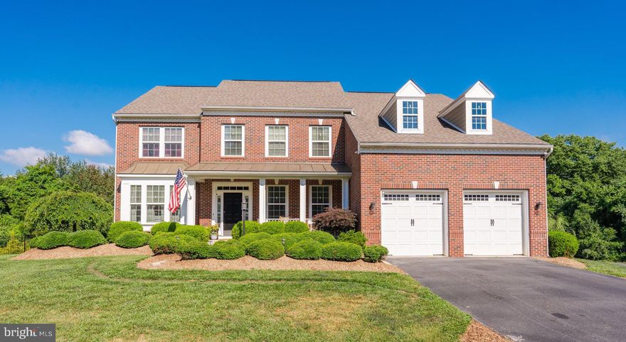 Wow! This exceptional, brick-front home rests on 1.76+ acres, with a custom gunite freeform pool, hot tub, and professionally designed hardscaping and landscaping. The resort-like backyard boasts not only the custom pool, but also a stone patio, outdoor fireplace and iron fencing.  As you meander through the outdoor spaces, you will notice that the  landscape architect spaced out a unique blend of year long beauty enhanced by front and rear lighting and mature peach, apple, and pear trees.  The perennial garden is a pollinator’s dream with hydrangeas, lilacs, peonies, butterfly bushes, milkweed, black-eyed Susan's, daffodils, tulips, and roses. A natural privacy wall has been created with the use of laurels and weeping willow.  You will experience an abundance of spring beauty with flowering dogwood and crepe myrtles.   But wait, there’s more to your backyard oasis, on cool evenings relax in the six person hot tub or warm up beside the stone outdoor fireplace! The custom pool includes blue stone coping, a pool heater, and brand new pool pump.  Staged for family comfort and enjoyment there is a Lifetime Playset surrounded by rubber mulch.  The backyard is easily accessed from the large Trex deck leading into the morning room or the finished basement. The attention to detail does not stop with your dreamlike backyard; step inside to become further infatuated with this property!  Upon entering from the covered front porch, hardwood flooring spans the main level and dual staircases.  An inviting formal dining space and family room flank the walkway to your gourmet kitchen with granite countertops, double wall ovens, stainless appliances, and two pantries.  The open kitchen lends itself to family time and entertaining with views into the living room. Here you will cozy up next to the wood burning, stone fireplace and soak in the abundance of natural light from the two story windows. For convenience, the two story blinds are remote controlled. The front entry garage leads into the  mudroom with built-in cabinetry and hook-ups for a first floor laundry area.  The current laundry area is conveniently located in the primary bedroom where you will also find an updated primary en suite. Relax in the primary bathroom with its freestanding bathtub and dual walk in shower.  Hardwood from the first floor also flows through the second floor walkway, primary bedroom and even further into the walk-in primary closet.  The second floor has three additional generously sized bedrooms, two of these with walk-in closets.  New flooring has been installed in these bedrooms.  The finished walkout basement includes a full bathroom and space that is being utilized as a flex fifth guest suite sleeping area.   With laminate hardwood floors the basement is ideal for a variety of uses including the equipped home theater or as currently used home gym.  The basement provides plenty of additional storage with a designated storage room and two large closets.  Recent improvements include two brand new Dykin 3 ton HVAC systems with built in whole house humidifier! The home also includes a reverse osmosis water system in the kitchen and whole house Culligan water softener.  The home is wired with an ADT security system that includes motion sensors on all windows and doors.  While living in Shepherdstown you may be inclined to enjoy all that this beautiful little town has to offer including time on the Potomac River, the 184.5 mile C & O canal towpath, less than 10 minutes away, and MARC within 15 minutes! With so many outdoor activities to enjoy, you will quickly utilize the custom built steel shed/pole barn that is conveniently tucked away (almost out of sight in the rear yard).  So, with three stories of finished space spanning 5,000+ sq ft, hardwood throughout, a gourmet kitchen and backyard oasis complete with pool, hot tub, and both indoor and outdoor fireplaces do not hesitate to capture this unique find as your new home!