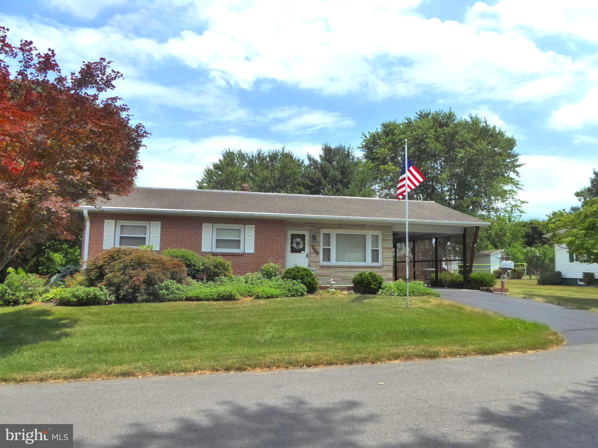 Call now to see this lovely one owner home located in the heart of Romney. You can't miss being drawn to the visual charm of the home. It features a nicely landscaped front yard, flag pole with a beautiful stone and brick face with T-111 siding. The home is spacious with 3 bedrooms and 1 bathroom on the main level and a den and full bathroom in the basement. You will notice decorative touches such as crown molding arched door way in the living room, along with new carpet. In the kitchen you have the island with an outlet, a built in buffet, pantry, tubular skylight and a small eating area. French doors lead to the dining room with a large bay window and door to the back yard. The room is large and makes for a great space to entertain family and friends. The bedrooms have closets with shelving making it easy to stay organized, wood floors and big windows that allow natural light to flow through. This home boasts of a lot of storage spaces on the main floor and basement. The stairs to the basement are carpeted and you step down directly in the cozy den that has a gas stove. The laundry room has front loading washer and dryer on pedestals and has ample space for a kitchenette with the gas stove already in place. With the vast storage space in the basement being set up as separate rooms, you could utilize those areas as bonus rooms, offices, a hobby room or whatever your heart desires. Also, some of the furniture and household items are negotiable. The carport offers some privacy with the slatted sides while letting the breeze flow through and that with the shade makes for a great outside area to enjoy beautiful West Virginia days. You can sit on the back porch swing. The back yard is level and is a great space. The barn style shed matches the aesthetic of the home beautifully and big enough for all of your yard tools and toys. This home is located within walking to distance to all of the great dining, shopping and local hot spots that Romney has to offer and the new elementary school.
