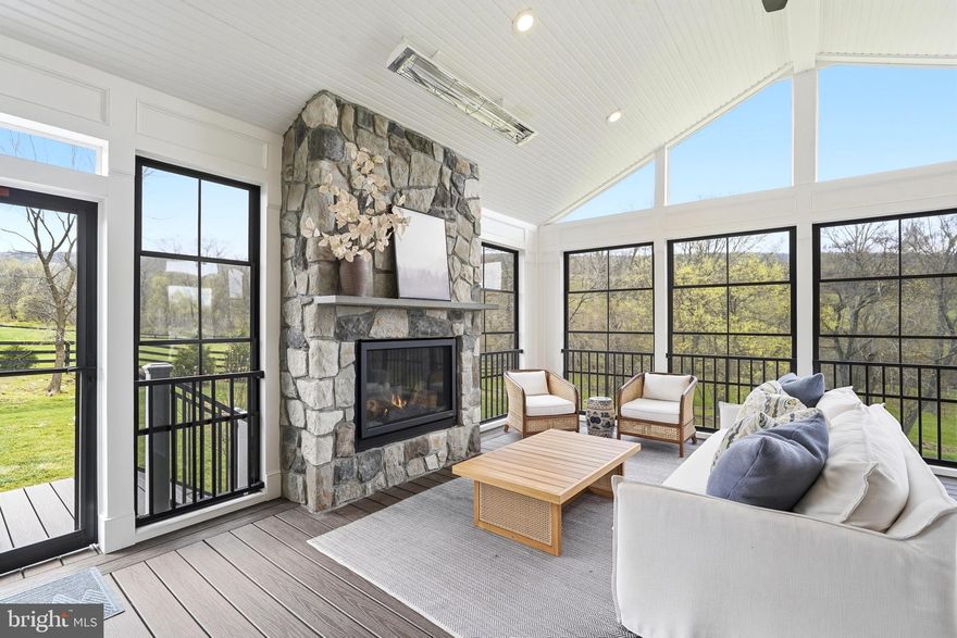 🏡 Welcome to this exquisite and highly sought-after Sagewood model by Carrington Homes, perfectly sited on 3 scenic acres in the Highlands of Round Hill with over $200,000 in upgrades. This stunning home features 4 bedrooms, 3.5 bathrooms, and more than 3,400 square feet of beautifully finished living space, including a stunning four-season room addition, with additional room to expand in the unfinished lower level.

🚪 A custom mahogany front door welcomes you into a dramatic foyer highlighted by crown moldings, graceful archways, an oak staircase with iron railings, and wide-plank flooring that flows throughout the main level. Thoughtfully designed for both everyday living and effortless entertaining, the home offers elegant spaces and exceptional craftsmanship throughout.

🍽️ At the heart of the home is the gourmet kitchen, centered around a 8-foot quartz island with seating and surrounded by cream-colored custom cabinetry. An additional wall of cabinetry with a built-in beverage refrigerator creates the perfect coffee bar or butler’s pantry area, ideal for both entertaining and daily use. A timeless subway tile backsplash, stainless steel appliances, and a spacious walk-in pantry complete this beautifully designed space.

🧺 Just off the kitchen is a mudroom and family planning area with custom built-in cubbies and storage, providing a functional everyday entry point from the oversized side-load three-car garage. The garage offers ample parking and storage, with additional space on the property to accommodate a future secondary garage if desired.

🔥 The adjoining family room features a gas fireplace, custom built-in cabinetry, and a full wall of floor-to-ceiling windows that flood the space with natural light and frame the surrounding landscape. French doors open to the Trex porch, creating a seamless indoor-outdoor connection. Just beyond, the stunning four-season room addition featuring a stone fireplace provides the ultimate setting for year-round entertaining, allowing you to enjoy the surrounding landscape and breathtaking Blue Ridge Mountain views in every season. 🌄

🎨 The main level also features a formal dining room including a custom Susan Harter pastoral mural, creating a truly unique and memorable space for entertaining. An elegant living room offers the perfect setting for welcoming guests or quiet conversation, while a private home office with custom built-in cabinetry provides a functional work-from-home retreat. With Verizon Fios available, working from home is convenient and seamless. Design enthusiasts will also appreciate the William Morris wallpaper featured in the main-level powder room and one of the upper-level bedrooms, adding timeless character and artistic detail.

🛌 Upstairs, the luxurious primary suite features tray ceilings, dual walk-in closets, and breathtaking mountain views. The spa-inspired primary bath offers a soaking tub, frameless glass shower, and dual granite vanities. Three additional generously sized bedrooms provide ample space, including two bedrooms connected by a Jack-and-Jill bathroom and one with its own private en-suite bath. A spacious upper-level laundry room completes the level.

⬇️ The large unfinished walkout lower level offers incredible potential for future living space and includes a rough-in for a full bathroom, multiple full-sized windows, and French doors leading to the backyard.

🌿 Outside, the expansive backyard provides endless possibilities, whether you envision a resort-style pool, custom outdoor kitchen, or additional entertaining spaces. Surrounded by mature trees and open green space, the property offers exceptional privacy and tranquility.

🎓 Located within the highly sought-after Woodgrove High School pyramid, part of one of Loudoun County’s top-rated school districts, this remarkable home blends luxury, functionality, and breathtaking natural beauty, with Blue Ridge Mountain Views.