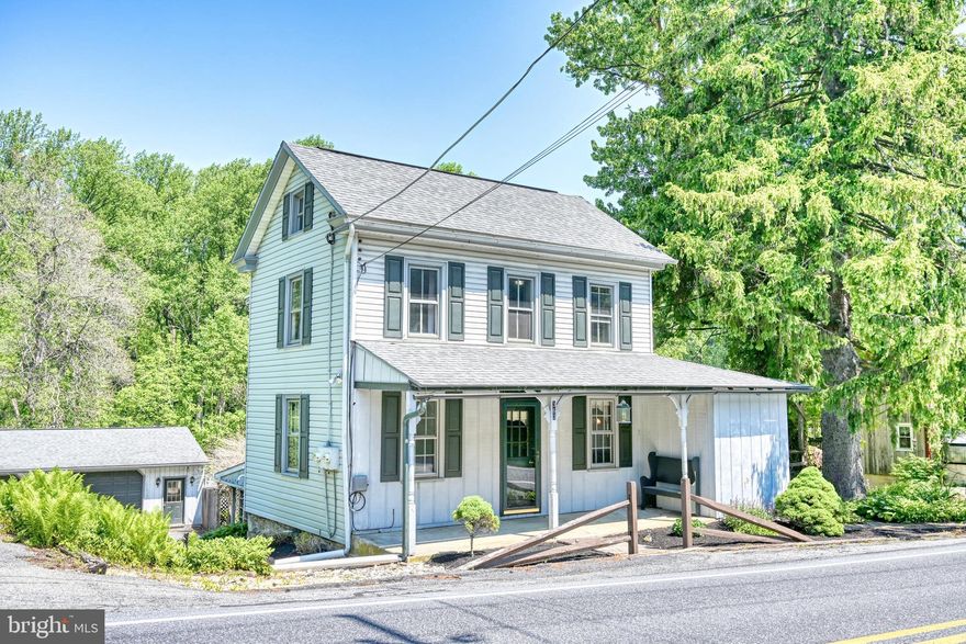 Nestled in the picturesque rolling hills of Berks County, just moments from the landmark Historic Galen Hall in Wernersville, this charming home effortlessly blends rustic appeal with modern comfort. Step inside to a welcoming layout that greets you with a formal dining room to your left and a spacious eat-in kitchen to your right. The kitchen is an inviting gathering space featuring a walk-in pantry, striking planked wood ceilings, and ample room for a large dining table. Just beyond, the living room serves as a cozy country retreat, showcasing exposed beams, beadboard ceilings, and an incredible brick fireplace with a propane log insert. Upstairs, the expansive primary suite features a private en-suite bath and a walk-in closet. The upper level also includes a second private bedroom and a versatile walkthrough room at the landing—perfect for a home office, hobby room, reading nook or 3rd Bedroom. Downstairs, the finished lower level provides even more living space, boasting a family room with a built-in bar, a second propane fireplace, a full bathroom, a dedicated laundry room, and a newly installed propane furnace. Outdoor living is a dream in this serene South Mountain setting. A welcoming front porch, side deck, and rear patio all overlook a beautifully landscaped yard filled with lush ferns and a peaceful, tree-lined backdrop. As a fantastic bonus, the property includes an oversized, heated two-car detached garage. Whether you are a car enthusiast, need abundant storage, or dream of running a home workshop (as it was utilized for many years), this space delivers. With all these features—plus the peace of mind of a brand-new roof—this Conrad Weiser gem won't last long. Don't delay; call to schedule your showing today!