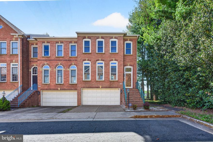 A  gated, lakeside community INSIDE-THE-BELTWAY, less than 3 miles from METRO... Welcome to the Yacht Club at Sequoia Village! This rarely available end unit 2-car garage townhouse boasts a dazzling array of upgrades and updates. It checks all the boxes - 3 levels of HARDWOOD FLOORS, roof new in 2025 with warranty, deck with stairs down to fenced rear yard, refined molding and trim, tons of natural and recessed lighting... The updated gourmet kitchen offers sleek white cabinetry, attractive backsplash, granite countertops, stainless steel appliances, center island and large breakfast area for casual meals! Formal dining room features elegant columns and chandelier with ceiling medallion. Three upper level bedrooms with soaring ceilings - including a spacious primary with ceiling fan, walk-in closet and gorgeous renovated (2024) LUXURY BATH (soaking tub, shower with frameless glass doors and double vanity). A full hall bathroom and convenient laundry complete the upper level! Downstairs, the recreation room offers a cozy gas fireplace, built in display shelves, walk-out to fenced rear yard and full-size windows - no dreary basement feeling here!!  Quarterly HOA fees of $325 (that's right, equal to less than $110/mo!) include trash and snow removal as well as the gated community's picturesque lake, walking trails, pool and clubhouse.  (Note that this section of townhomes has a small additional fee for optional use of  the pool - but they have lower quarterly HOA fees!) Buyers will appreciate the amenities but they will LOVE the convenient location - enviable proximity to major routes of transportation, minutes from the shops, dining & entertainment at Mosaic District, less than 3 miles from Dunn Loring Metro, easy access to Tysons Corner, steps from Providence Rec Center.... it doesn't get much better than that!!