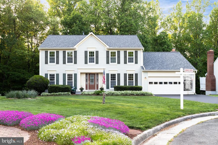 WELCOME HOME! This stunning MOVE-IN READY home located just a few minutes from Fairfax County Parkway, but a  world away  on this quiet cul-de-sac in Fairfax Station which backs to parkland! This home is a mere few minutes from Lake Mercer and the trails which so easily connect to Burke Lake and the myriad of other convenient trails also intersecting Fairfax Station! This gorgeous rare Triple Ridge Home is not part of an HOA, but by the tree-lined manicured lawns you would never guess it! The 4 bedrooms, 2.5 bath home has recently been FULLY updated! New paint, new flooring and new finishes make this home a dream come true! Step into the 2-story foyer and turn to the 1st floor office with glass French doors or to the large formal living room and dining room which is flooded with light.  A large gourmet kitchen boasts an island, new granite and new stainless-steel appliances and newly updated cabinets! Enjoy the new Urban Rustic light fixtures with the newest Edison Bulbs which add ample light to the kitchen and the breakfast nook! Add a large walk-in pantry and this kitchen is a dream!  The new hardwoods lead you into the sunny breakfast nook and then to the large family room with a gas fireplace and loads of windows. This home boasts a BRAND-NEW ROOF and LIFE-TIME Warranty Thompson Creek windows, gutters and front door for true maintenance-free living!!  Walk downstairs to a large light-filled walk-out finished basement. In addition, there is an over-sized storage room. Venture outside to a patio and a nice deck or sit among the trees and revel in the quiet of the parkland behind you!  Upstairs are 4 large bedrooms with brand-new carpet and 2 updated bathrooms with granite countertops and updated fixtures. The Master suite also boasts an extra-large walk-in closet and an extra storage closet too.  Recent additions include a new hot water heater. This home has AMAZING COMMUTE OPTIONS -- it is just 6 miles from the Springfield Metro and 3.9 miles from the Lorton VRE Station. Two Commuter Lots are a mere 1.7 miles away!  This lovely home is also part of the Silverbrook Elementary & South County School pyramid!