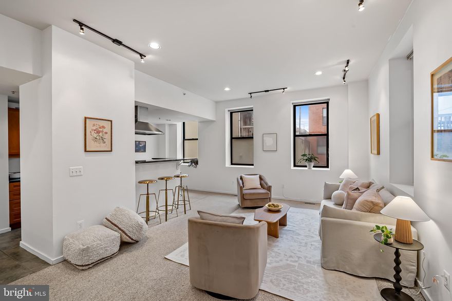 In the heart of Federal Hill, this home offers a opportunity to own a rarely available  two level condo in one of Baltimore’s most vibrant and convenient neighborhoods.  

This desirable main-floor unit features high ceilings and oversized windows that fill the space with natural light in the morning and during golden hour. The first level offers an open, functional layout with room for both living and dining, plus a galley kitchen that makes excellent use of the space. The flow feels airy, comfortable, and well-suited for both everyday living and entertaining.

The lower level offers two generously sized bedrooms and two full baths, including one bedroom with a private en-suite with a walk-in shower and outdoor access. Walk-in closets, additional storage closets and a  in-unit washer and dryer are a rare and valuable find here.

Beyond the unit itself, the building amenities truly elevate the lifestyle. Residents have access to a rooftop deck with city views that is perfect for relaxing, entertaining, or catching fireworks, a spacious courtyard, fitness room, basketball court + more. Secure building access gives you peace of mind. 

Just outside your door, you are just steps away from  highly rated restaurants, coffee shops, gyms, parks, with quick access to the waterfront and major highways. Whether you are searching for a stylish and modern primary residence or an investment with strong rental potential, this home offers low-maintenance living, great amenities in an unbeatable location at an attractive price!