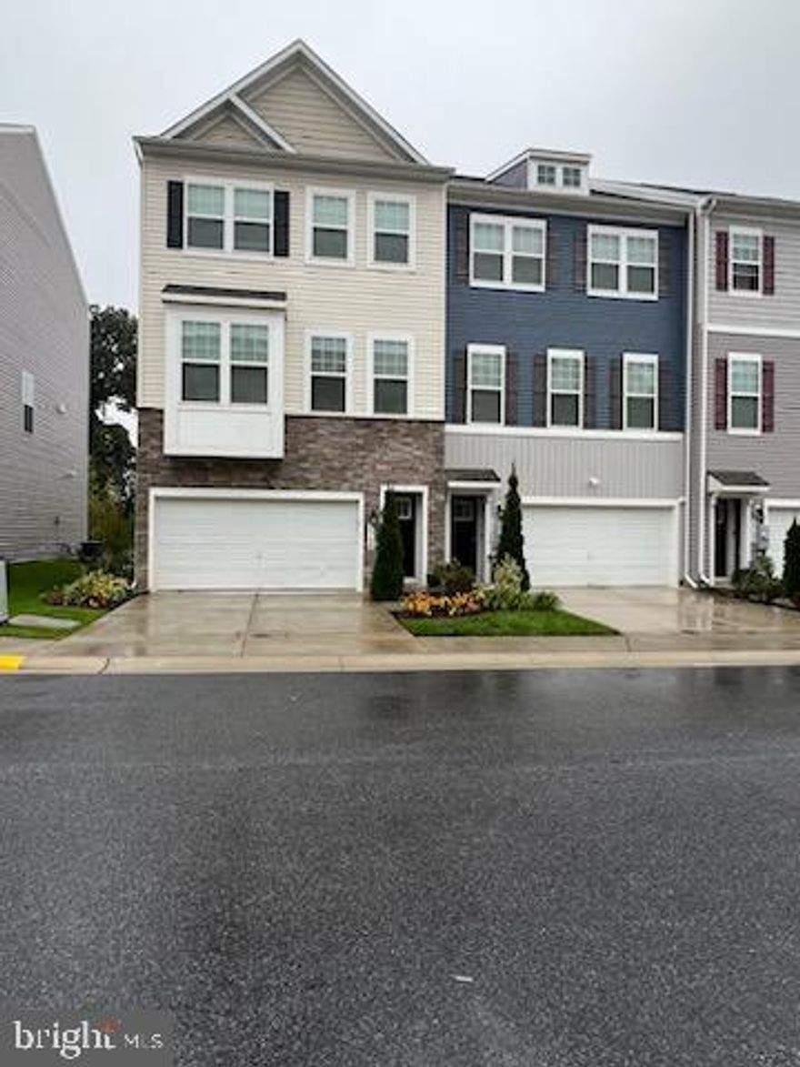 Beautiful End of Group Unit 3 level townhome, with three bedrooms, 2.5 baths and a fully finished basement. This house was built in 2019, and has all the bells and whistles! Property includes: a two-car garage and a driveway. Deck is built off of the main level giving a nice peaceful vibe.  Kitchen has stainless steel appliances. Separate dining room area next to the kitchen with a clear view outdoor seating. Breakfast bar/island located in kitchen. Hardwood floors are located on the main level; basement, upper level, and stairs are carpeted. Owner’s suite has a full bath located inside.  Here is the best part...NO more lugging clothes to the basement.  The washer and dryer are conveniently located upstairs on the same level as the bedrooms. There is also a rough-in located in the basement ready for a bathroom install. The neighborhood has an exercise area, playground, and gazebo. Property is located in close proximity to: BWI Airport, Fort Meade Army base and other area attractions , Live Casino. This homes screams Must Have!