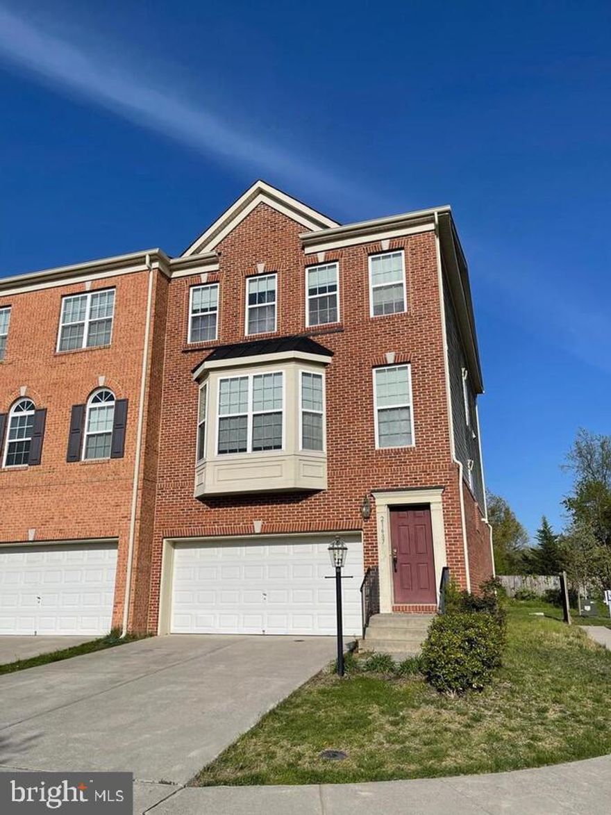 Welcome Home in the Reserve at Waxpool- 21687 Loganberry Ter, Brambleton.
This stunning brick-front end-unit townhome offers the perfect blend of modern elegance and functional living. With 3 bedrooms, 2 full baths, 1 half bath, and a 2-car garage, this home provides 2,864 square feet of thoughtfully designed living space to suit your lifestyle.
Step Inside to Discover:
A bright and open floor plan that adapts effortlessly to any furniture arrangement.
Brand new carpets (2022) installed throughout, complemented by fresh paint for a move-in-ready feel.
French windows in the living and dining areas that flood the space with natural light, creating a warm and inviting atmosphere. Recessed lighting and 9-foot ceilings throughout the main level, adding a touch of sophistication and spaciousness.
Chef’s Delight Kitchen:
Stainless steel appliances and granite countertops for a sleek, modern look.
A large center island with a breakfast bar, perfect for casual meals or entertaining.
Ample storage with a spacious pantry to keep your kitchen organized.
Luxurious Owner’s Suite:
A spacious bedroom with a walk-in closet for all your storage needs.
An owner’s bath featuring dual vanities, a soaking tub, and a stall shower for a spa-like retreat.
Generously sized secondary bedrooms with ample closet space.
A spacious lower level with a large recreation area, ideal for a home theater, gym, or playroom.
A walk-out basement that opens to a serene, tree-lined backdrop, offering privacy and tranquility.
Community Amenities:
Ample visitor parking for guests. A sand volleyball court and tot-lot/playground for outdoor fun.
Unbeatable Location: Minutes from Dulles Airport and Dulles Towne Center for convenience. 
Easy access to major routes like 267, Route 7, and Route 28, with the future DC Metro nearby.
Surrounded by a wide variety of retail shops, specialty stores, and restaurants for all your needs.
Located in the sought-after Waxpool/Eagle Ridge/Briar Woods School triangle, making it ideal for families.
Don’t Miss Out!
This home truly has it all—modern upgrades, a prime location, and a welcoming community. Whether you’re relaxing in your spacious owner’s suite, entertaining in the open-concept living area, or enjoying the outdoors, this townhome is the perfect place to call home. Don't miss out!