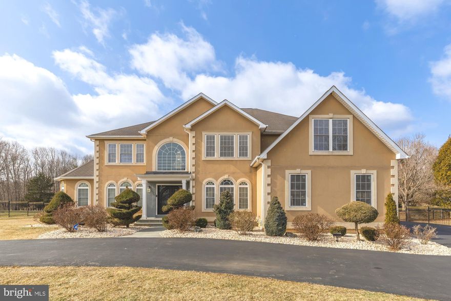 Price improvement! Set on a sprawling 2-acre lot in prestigious Stoney Creek Estates in Potomac, this breathtaking 6-bedroom, 5.5-bathroom home offers approximately 6,800 square feet of newly renovated luxury. Designed to impress, this home boasts vast open living spaces, two primary suites (including one on the main level), a sprawling backyard, and a 3-car garage with EV charging station. Drive through the remote-control gates and onto the circular driveway, providing effortless access and enhanced security. Just minutes from Potomac Village, this masterpiece seamlessly blends timeless elegance with modern upgrades.

Step through the stately double doors into an awe-inspiring entryway, where natural light pours in and soaring ceilings create an immediate sense of grandeur. A remote-control chandelier in the foyer adds a unique touch and easily lowers for cleaning. Just off the foyer, discover a rare and expansive main-level primary suite, a true sanctuary featuring custom built-ins, an opulent ensuite bath with marble flooring, double vanities, a soaking tub, and a walk-in shower. The suite flows into a brand-new, dream-worthy enormous walk-in closet. A formal den, currently used as an elegant dining room, sits just beyond the entryway.

At the heart of the home, a dramatic family room stuns with its vaulted ceilings, floor-to-ceiling windows, and a striking fireplace that serves as a captivating focal point. The adjacent gourmet kitchen is a chef’s delight, featuring white cabinetry, stainless steel appliances, a large center island, a walk-in pantry, and a stylish wet bar with wine storage. The open-concept breakfast area easily accommodates seating for ten, seamlessly connecting to an expansive outdoor deck with a covered porch—perfect for al fresco dining, lounging, and enjoying the sprawling, private backyard. A laundry room and powder room complete the main level for ultimate convenience.

Ascending the sweeping staircase, you'll find new hardwood flooring throughout. A second luxurious primary suite awaits, complete with multiple walk-in closets and a spa-like ensuite bath featuring a soaking tub, walk-in shower, and bidet. A loft area overlooking the grand family room enhances the home's open and airy feel. This level also hosts three additional spacious bedrooms and two full baths, including one ensuite and a Jack-and-Jill bathroom.

The newly finished 2,000-square-foot lower level is like a home within a home, offering a vast recreation area, a living room, a fully equipped kitchen, a bedroom, full bath, a den, and ample storage space. High ceilings, premium LVP flooring, and full daylight windows create a bright and inviting atmosphere. Walk out directly to the patio and enjoy easy access to the backyard.

This exquisite home is a rare gem in tranquil Potomac, offering a peaceful retreat just moments from premier shopping, dining, parks, and the scenic Potomac River. With a three-car garage and thoughtful renovations throughout, this property is the pinnacle of sophisticated suburban living. Don’t miss the opportunity to call this extraordinary estate your home!