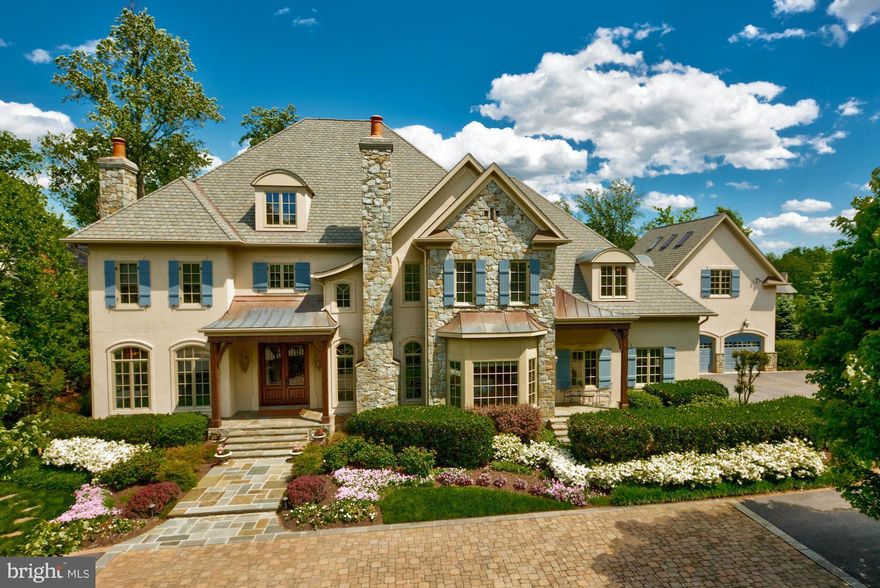 Beautiful residence in The Reserve on private & lush setting w/ expansive public rooms, gourmet kitchen w/ light-filled breakfast room, main level guest suite, master suite w/ large sitting room, walkout lower level w/ 10 Ft.+ ceilings, & a separate guest/au pair suite over garage. Immaculate landscaping & hardscaping throughout w/ multi-tiered deck,water fall & rear stone patio w/ outdoor fp.