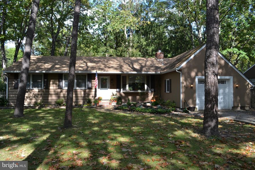 Vacation at home w/ the LAKE LIFE & enjoy EASY LIVING all on one floor in this 3 bedroom, 2 full bathroom, light, bright & airy RANCH home on a corner lot in the highly desirable Medford Lakes community.  The many features include an inviting covered front entry, hardwood flooring, many windows for natural light to come streaming through, large living room w/ wood burning fireplace & picturesque bay window, darling dining room, eat-in kitchen w/ plenty of cabinetry, Corian counters, tile backsplash, stainless steel appliances (all included – dish washer & refrigerator approx. 2 yrs new) & door to back deck.  There are 3 spacious bedrooms w/ ample closet space (w/ organizing systems) on the one side of the home & a well-appointed full bathroom w/ laundry area (washer & dryer included). There is a possible in-law or teen suite on the other side of the home w/ living area, 4th bedroom w/ walk-in closet & full bathroom (can also use these rooms for home gym, playroom, home office, etc.).  The generously sized (for Medford Lakes) fully fenced backyard & deck are great for entertaining.  Other amenities include one car garage w/ attic access for storage, NEWER well pump & water softener system just serviced. Enjoy all that the Medford Lakes culture has to offer including the many lakes (swim, canoe, ice skate & more!), lounging on the beaches (5 beaches in total), picnic areas, Vaugh Hall community center, community activities like Canoe Carnival, walking & bike trails, baseball fields, tennis courts, pickle ball courts, basketball courts, volley ball, playgrounds, kids summer camp, local dog park (Freedom Bark), many other local parks, golf, highly rated schools, eateries, shopping, local breweries & so much more (Colony bond in place)!  Easy access to major highways, shore points, Atlantic City, NYC & Philly!  ONE YEAR HOME WARRANTY INCLUDED!