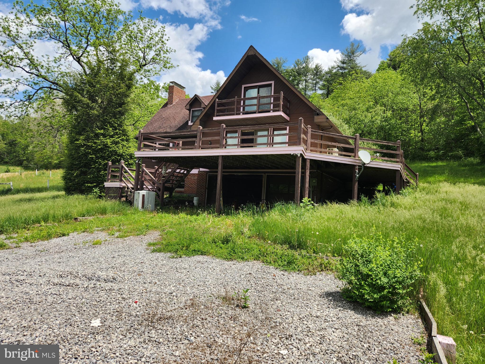 Welcome to Big Run Rd! This beautiful property consisting of 25.75 acres. This property is secluded and surrounded by woods, fields and Shaffer Creek. This magnificent property has 2300 feet of road frontage and creek frontage. The house is very spacious. Walk in basement with wood fireplace. Two car garage. Entering the main level from the large deck into the living room, open to the dining room. Large gally kitchen with sliding glass doors to the back deck. Full bath and laundry on the main floor. Large room that could be used for a bedroom or office. Second floor consists of large bedroom and full bath. Extra storage room off of the bath. Very suitable for horses, cattle, goats, sheep and other livestock. Barn has stables with second floor storage space, Call for a showing today!