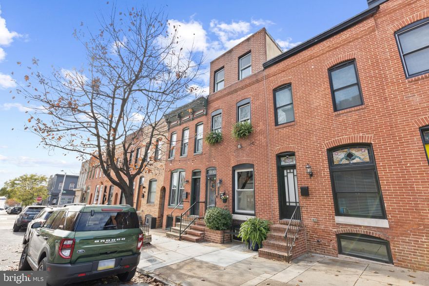 EXPANSIVE CANTON HOME FEATURING OVER 3000 SQ FT OF LIVING SPACE WITH REMARKABLE VIEWS FROM ROOF TOP DECK - this meticulously maintained home in A+ Canton location features an open floor plan with hard wood floors throughout, sleek metal staircases, exposed brick, crown molding all appointing a large living room, separate dining area and eat-in kitchen offering granite countertops, ss appliances and an abundance of cabinetry for storage.  The upper levels boast 3 large bedrooms, stylish bathrooms and an incredible roof top deck with panoramic views of downtown and the waterfront.  Not to be missed is the finished basement & rear patio great for entertaining - this is a must see!
