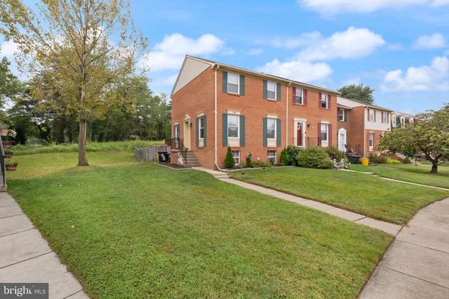 **ASSUMABLE LOAN 2.75%** Spacious all-brick end-unit townhome located in Elizabeths Landing. The main level features hardwood floors and a bright kitchen with 42" oak cabinets and newer stainless steel appliances. Designer bathrooms showcase custom tile work and updated finishes throughout. The primary bedroom offers generous space along with walk-in closets. Enjoy outdoor living on the deck with sliding door access. The fully finished basement includes a full bathroom and offers potential for an additional bedroom, home office, or guest space. A well-maintained home with room to grow in a sought-after community.