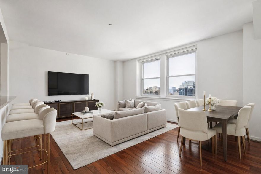 Enjoy breathtaking skyline views and stunning sunsets from this deluxe one bedroom penthouse residence in the sky. The elegant living and dining areas offer 9 foot high ceilings, gleaming hardwood floors, and oversized windows that flood your space with an abundance of light. The gourmet kitchen boasts a breakfast bar, shaker style cabinets, and rich granite countertops. The bedroom is generously proportioned and offers ample closet space. The spa-like bathroom features ceramic tile flooring, designer fixtures, and ceramic sink with storage vanity. A 24-hour concierge, stunning rooftop deck, and on-site fitness center complete this coveted residence at the Packard Grande. Valet parking is available next door in a public garage for an additional fee . Perfectly situated in the Rittenhouse/Avenue of the Arts area, this home is steps from fine dining, world-class shopping, renowned cultural destinations, and vibrant nightlife. Conveniently close to UPenn/Drexel campuses, HUP/CHOP hospitals, and all major public transit lines.