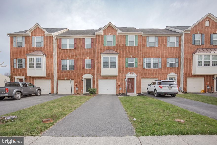 This townhouse is the one you are not going to want to miss.   First thing you will notice is upon pulling up to this home is the beautiful brick front and 1 car garage.   Upon walking in you will see a large  bedroom featuring a large closet and its own private bathroom.   Heading up the steps to the main level you will see a large living room, well equipped kitchen including newer stainless steel appliances , dining room, and a morning room on the back.   This level also features a power room.   Going up to the main level you will find the primary bedroom with cathedral ceilings, connecting to a  private bathroom featuring a separate soaking tub and shower and double vanity.   Down the hall you will fine two more bedrooms and  a 3rd full bathroom.    This home has had many updates recently including some new carpet, paint , and a newer hot water heater.   Furniture is negotiable.   Schedule your showing today as this house will not last long.