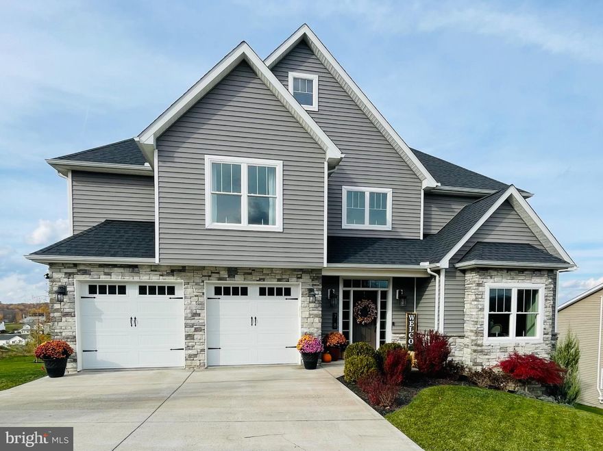 Experience refined comfort in this 5-bedroom, 3.5-bath home in Harvest Ridge built by Wise Guys Builders. Featuring soaring ceilings, 9-foot main-level heights, and abundant natural light, every space feels open and inviting. Enjoy granite countertops, pot filler, hardwood floors, a private office, and a finished basement with generous storage. Custom exterior access door added to the lower level, creating functional built-in storage for outdoor and lawn equipment. Stunning sunrise and sunset views complete this exceptional home.