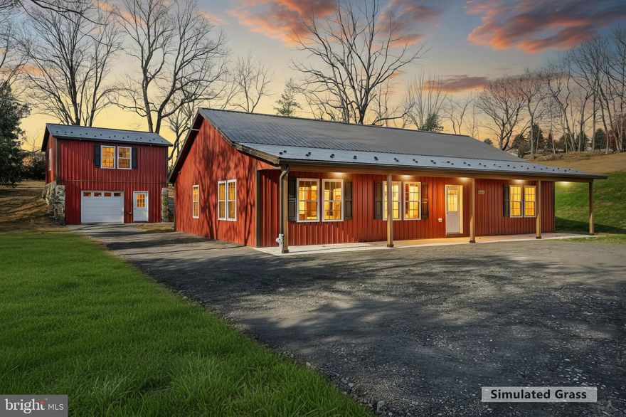 Welcome to 10640 Enfield Rd., a beautifully crafted barndominium-style home by National Home Services, offering modern, single-level living on a private 1+ acre lot in Felton. Thoughtfully designed for comfort, efficiency, and low-maintenance living, this home features the signature clean lines and durable metal construction these barndo homes are known for.

Step inside to an inviting open-concept layout with 3 spacious bedrooms, 2 full bathrooms, and a bright living space that blends everyday functionality with easy entertaining. The kitchen shines with granite countertops, soft-close cabinetry, stainless steel appliances, and a large center island that anchors the room. The owner’s suite offers a walk-in closet and a well-finished private bath.

A full-length front porch with recessed lighting adds charming curb appeal and a perfect place to unwind. The exterior continues to impress with exceptional parking, including a large parking pad ideal for an RV, trailers, or multiple vehicles.

What truly sets this property apart is the oversized 1-car detached garage—a standout feature rarely found in homes at this price point. Set on a beautiful stone foundation and built to match the home’s barndominium style, the garage features soaring ceilings and space for even the largest vehicles. Above it, you’ll find a newly built second floor offering over 600 sq. ft. of pre-wired, ready-to-finish space. The possibilities here are endless: create a man cave, private office, playroom, in-law suite, guest apartment, or a separate living area for extended family. It could even serve as the perfect setup for a home-based business.

Additional perks include an all-electric layout ideal for energy-conscious buyers or future solar use, a peaceful and private setting, and room for future outbuildings if desired.

A truly versatile property with unmatched potential—move-in ready and waiting for its next owner. Let this be the barndo that fits your lifestyle now and still grows with you over time.