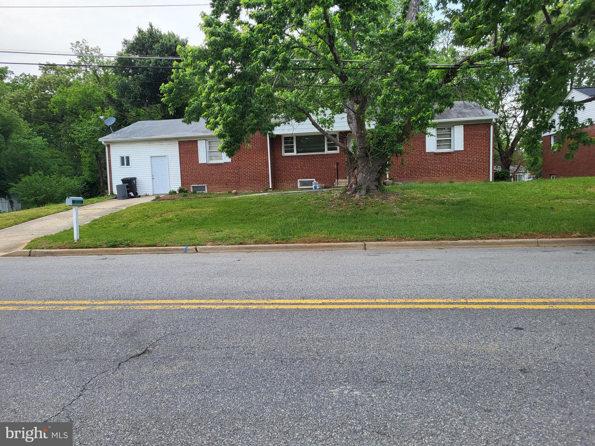 This 4-Bedroom, 4-Full Bath home has much more space than it appears to have by looking at it from the outside. The main level has 3 bedrooms, 2 full baths, table-space kitchen, separate dining room, den, & living room with a fireplace . The lower level has a table-space kitchen, 2 full baths; a bedroom, family room with fireplace, laundry room and 2 Flex rooms that could be used for whatever you want them to be. There may also be the potential for additional income by using the lower level as an Accessory Dwelling Unit.