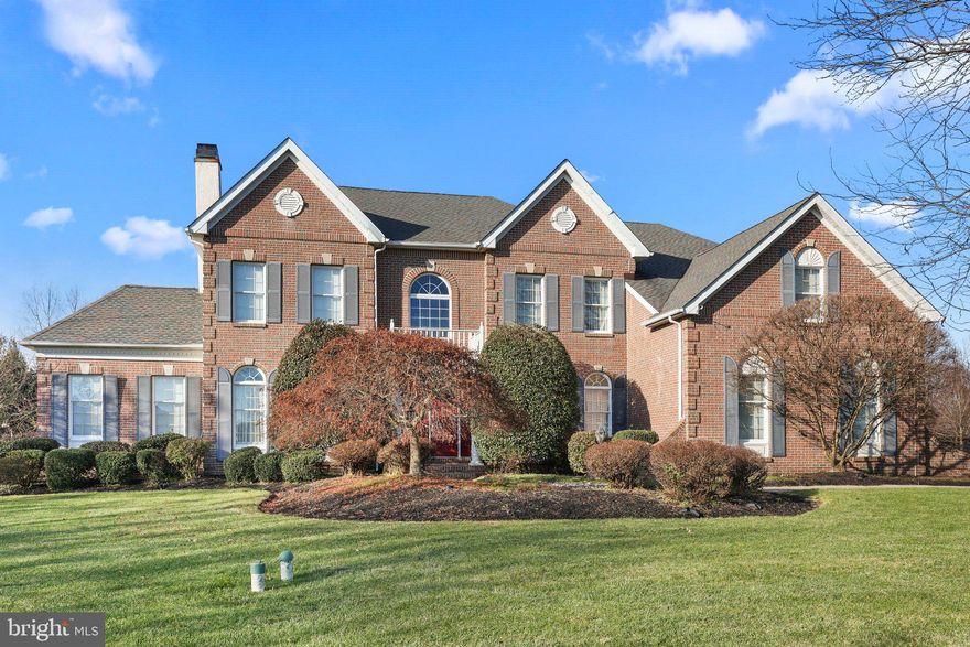 Luxury 4,500 sq.ft. Brick Front Center Hall Colonial situated on One Acre of parklike grounds consisting of Four Bedrooms and Four Bathrooms. Original owner takes much pride in the maintenance, appearance and curb-appeal. It is perfect and the open floor plan is great for entertaining. Double door front entrance into two-story foyer with butterfly staircase and upper bridge overlooking the foyer and family room with vaulted ceiling, two skylights, and highlighting a fireplace with brick hearth extending from floor to ceiling. Formal living room and Dining Room. The Living Room shares a gas fireplace with the adjacent Den having cathedral ceilings and an abundance of windows. Dining room with trayed ceiling. Hardwood floors. Decorative ceiling and chair-rail molding throughout. First floor Office with large bay window overlooks back yard. Spacious and open kitchen with center island, 42” cabinets, granite countertops, recessed lights, and pantry. The breakfast area open to sunroom with skylights and back door leading to backyard patio. First floor laundry room with wash sink and door to backyard patio. Upstairs is the Primary Bedroom with decorative trayed ceiling, spacious sitting room, large walk-in closet with built-ins, and ensuite bathroom with double vanity, soaking tub, separate shower, and water closet. Three additional nicely sized bedrooms with ample closet space. Enormous full unfinished basement with poured concrete perimeter. Three car garage. Enjoy the pristine paver block patio and free-standing gazebo overlooking the manicured landscape and backyard. Enjoy the proximity to shopping, restaurants, parks, and an easy commute.