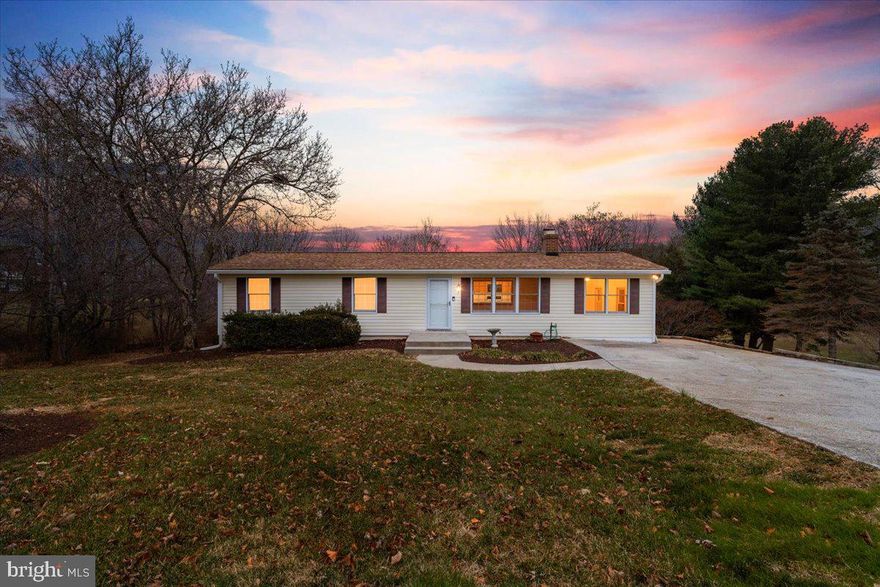 This inviting 3-bedroom, 2-bath home offers single-level living at its best on a serene 1.5-acre lot. Inside, the main level features an eat-in kitchen with a breakfast bar, a dining area, and a spacious living room, along with three bedrooms and a full bath. A step-down family area provides additional living space, while the partially finished basement includes a large family room with a wood stove, full bath, and an extra room ideal for a bedroom, office, or hobby space. Walk out from the basement to a private backyard retreat with a deck, above-ground pool, and open yard for outdoor enjoyment. With fresh paint throughout, a new carpet, storage shed, and off-street parking, this home is move-in ready and perfectly suited for those seeking peaceful living with plenty of space both inside and out.