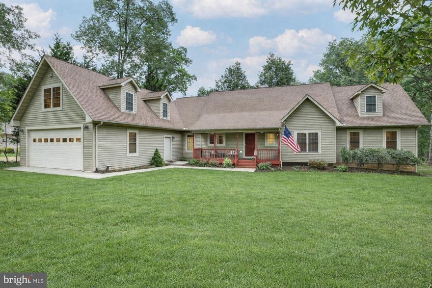 From mornings on the water to evenings by the firepit, this is the Lake Anna lifestyle just in time for summer! 
Welcome to a beautifully maintained, furnished  (most furnishings can stay or be moved if needed) 5-bedroom water access home in one of Lake Anna’s most sought-after communities—complete with your own assigned boat slip #270 just a short walk away
Windwood Coves on the public side of the lake is known for its exceptional amenities and strong sense of community—homes here are coveted for their mid lake location and deep water.  Residents enjoy a private beach, assigned slips, large gathering gazebos, tennis and volleyball, playgrounds, and more—everything you need to fully embrace lake life.
Inside, the main level offers an open, airy layout with soaring vaulted ceilings and abundant natural light. The living room, dining area, and kitchen flow seamlessly together, anchored by a cozy gas fireplace and warm hardwood floors. The kitchen features stainless steel appliances, a generous island with seating, pantry storage, and ample cabinet space.
A standout feature is the stunning four-season room, wrapped in floor-to-ceiling windows—perfect for relaxing and taking in peaceful, wooded views year-round.
The main-level primary suite offers comfort and convenience with a private bath and walk-in closet, along with two additional bedrooms and a full hall bath. Above the garage, a separate two-bedroom apartment with its own full bath provides the perfect setup for guests, extended family, rental, or added flexibility.
Step outside and you’ll find a backyard designed for making memories. The expansive deck overlooks a private, tree-lined setting, now enhanced with a brand-new hot tub with stepping stones leading to a professionally installed fire pit creating a seamless flow for entertaining or unwinding under the starts.  A welcoming covered front porch adds even more charm.
Additional features include a huge two-car attached garage with a separate area for a workshop or storage, an unfinished basement for storage or hobbies (mancave or she-shed :) , a detached shed for all of your toys, and a newly paved driveway for added convenience and curb appeal.
Recent updates include a newer HVAC system, kitchen appliances, and washer and dryer (2022), Septic recently pumped and inspected, new distribution box and brand new well pump.
Your assigned deep-water boat slip (#270) is just a short walk away, making it easy to enjoy everything Lake Anna has to offer. House comes fully furnished or items can be removed upon request. 
Ideally located just minutes from the prestigious Cutalong Golf Course, as well as grocery shopping, local restaurants, breweries, and wineries—there’s truly never a dull moment. Plus, you’re within easy driving distance of Richmond, Charlottesville, Fredericksburg, and Washington, DC.