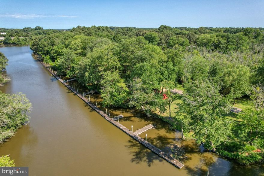 🌊 <B>Looking for Your Own Private Paradise With  Delaware Bay Access?</B>
<br>
<br>
Welcome to <B>Riverhouse Marina</B>— a rare, gated waterfront estate that feels more like a private resort or state park than a single property. Set on over 8 acres of pristine waterfront, this one-of-a-kind retreat offers approximately 1,000 feet of frontage along the Mispillion River and over 500 feet of dock space with water and electric, delivering quick, <B>deep-water access to the Delaware Bay.</B> 
<br>
<br>
Whether you’re boating, entertaining, investing, or simply unplugging, this property delivers freedom, privacy, and possibility.
<br>
<br>
⚓ <B>Marina, Grounds & Entertaining</B>
-Over 500 ft of dockage with utilities
-Three RV hook-ups with room to expand
-Pavilion and Tiki Bar area — perfect for events & gatherings
-Expansive parking for guests, trailers, and toys
-No HOA — use it your way
-Ideal for Airbnb, Hipcamp, private retreats, or personal use
<br>
<br>
🏡 <B>Waterfront Living at Its Finest</B>
<br>
<br>
The home offers nearly 360-degree water views, immersing you in nature from every angle.
<br>
<br>
<B>Highlights include:</B>
-Primary suite with private balcony and massive walk-in closet and full bath
-Vaulted ceilings for an open, airy feel
-Kitchen island ideal for entertaining
-Hardwood floors throughout the first floor
-Convenient first-floor full bedroom anf full bath
-NEW electric fireplace for modern warmth and ambiance
-NEW dishwasher
-Newer roof (within last 2 years) with transferable warranty
-NEW water heater
<br>
<br>
🛠️ <B>Bonus Buildings & Extras</B>
-Large outbuilding / warehouse / garage for boats, equipment, and toys
-NEW heater installed in the warehouse/garage building
-Includes two golf carts for easy cruising around the property
<br>
<br>
🌿 <B>Lifestyle & Location</B>
This property truly feels like your own private nature preserve — abundant wildlife, peaceful water views, and endless space to explore.
-Minutes to downtown Milford for shopping & dining
-Quick access to Route 1
-Delaware Bay beaches — approx. 10 minutes
-Delaware resort beaches — approx. 30 minutes
<br>
<br>
This is not just a home — it’s a destination, an investment, and a legacy property all in one.
Opportunities like this simply do not come around often.
<br>
<br>
🎥 Be sure to watch the detailed video tour in the virtual link and experience Riverhouse Marina for yourself.
<B>You won’t find anything else like it.</B>