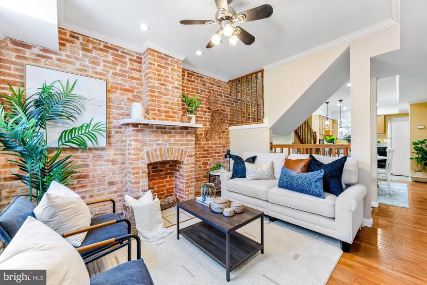 Open house cancelled. Why rent when you can own? This charming 2 bedroom, 1 bathroom classic Baltimore row home has been well maintained and ready for new owners! Fall in love with the brick wall & decorative fireplace in the living room, gleaming hardwood floors, freshly painted neutral color walls, and cozy floor plan. In the rear of the home is a large sized kitchen with tons of countertop space for those who cook or like to entertain. The rear door leads to a back deck and fully fenced in patio - great for pets or those who needs some outdoor space to relax. Upstairs are 2 decent size bedrooms w/ closets with a large full bathroom in the hallway. You could absolutely occupy both bedrooms with full size beds! The basement is mostly finished space which could serve as an additional 3rd bedroom or living space. There is also storage space and washer/dryer. Pigtown is one of those neighborhoods that has tremendous value offering affordable living with the city life perks. This home is extremely close to both Ravens and Orioles stadiums, major highways, and Inner Harbor/Downtown attractions. This home would also serve well as a rental/investment property for UM students and employees! The current property taxes are only $1,888.00 for 2024/2025 - buy this home and apply for homestead tax credit. Preferred lender estimated monthly payment around $1,600 with as little as 3% downpayment!