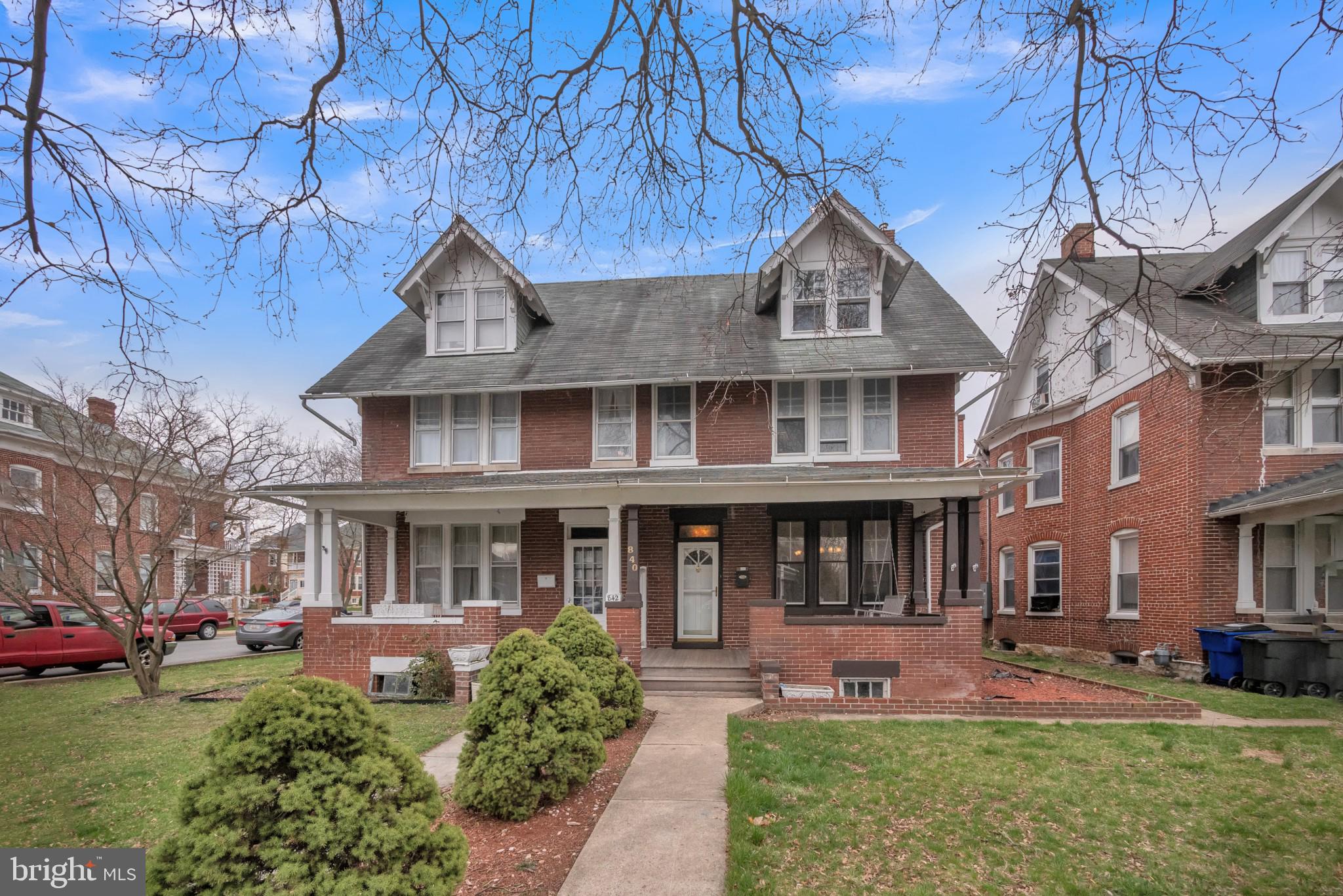 Welcome home to this beautiful brick front Colonial in sought North Hagerstown! Plenty of room to grow in this 4 bedroom, 2 bath home with nearly 2,500 sq ft of space! Beautifully landscaped with foundational bushes lining the walkway that abuts your spacious front lawn. Take a break on your welcoming front porch that includes a swinging bench - the perfect place to enjoy a nice hot cup of your favorite beverage! Enter into a light and bright foyer and the living room that features stately pillars framing the entryway, crown molding, and a 5 light chandelier. Also features a decorative fireplace with mantel. Entertain guests easily in the formal dining room with a curved wall of windows, chair railing, and centerpiece chandelier. The spacious kitchen features plenty of counter and cabinet space and a connected island with an electric stovetop. Also features a deep sink with window view, wall microwave and oven, double door fridge with ice maker, and a built in workstation. Glass door leads to the outdoors and makes for easy grocery drop off. Full bath with tub/shower combo completes the level. Take the stairs to the second level with hardwood floors flowing throughout. All three bedrooms feature cooling ceiling fans and large closet space - including the large walk in closet in the main bedroom. Hall bath with stall shower and tile walls completes the level. The 4th level attic features plush carpeting and cooling ceiling fan and is perfect for a 4th bedroom, rec area, additional living space or home office. The basement is framed and ready for you to complete into additional living space or keep as is for storage. Easily entertain on the back porch over looking the easy maintenance fenced in back yard - the perfect place for a summertime BBQ! Near multiple shopping and dining destinations and easy access to 81. Do not miss this one!