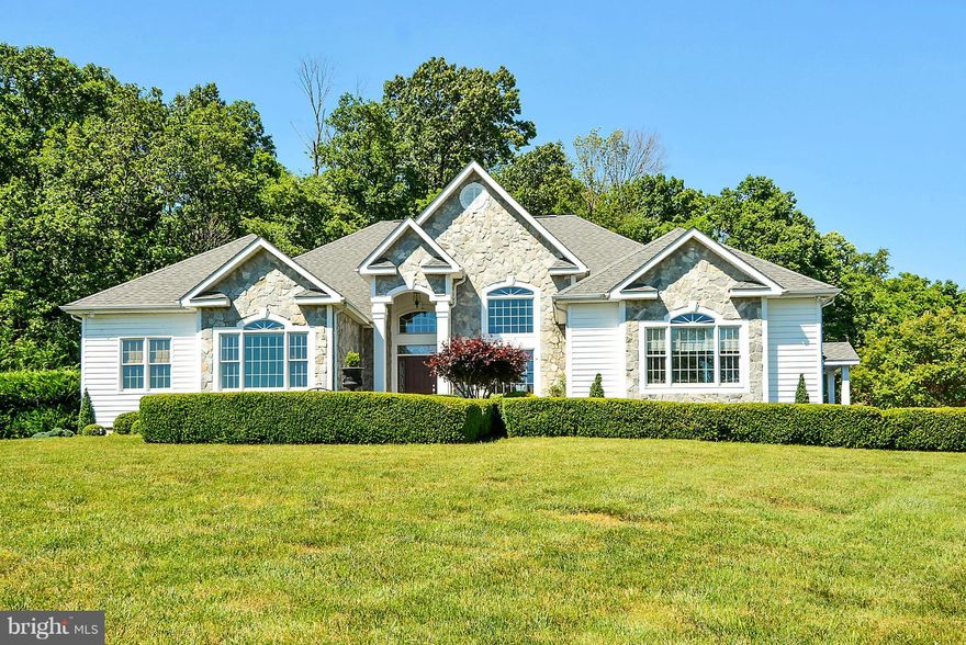 Stunning custom built home with 3215 sq. ft. on one level.  This home is elegant and spacious throughout with high ceilings, crown moldings, and hardwood floors. Loads of windows flood the open floor plan with natural light.  All the amenities you expect to find with a custom home plus some you don't.  Homeowner is accommodating.  Please call showing agent to schedule showing. HMS Warranty.