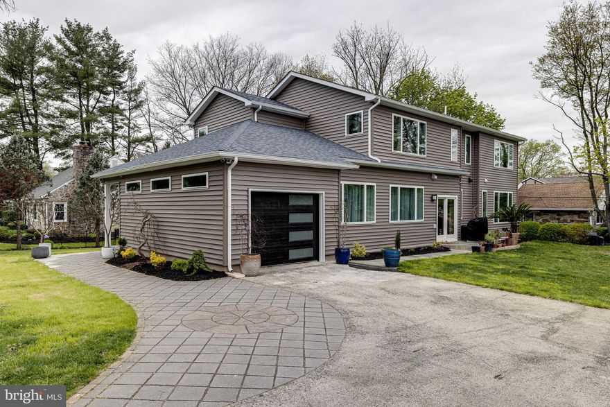 Rarely Available Newer Construction in desired Bala Cynwyd! Location, location, close to schools, parks, restaurants and downtown! Enter this oasis with the beautifully tiled floor in the entry and hang your coats and stay awhile. Then enter the open living area with natural wood floors throughout. Head to the sunroom with a brick fireplace from the floor to the ceiling and open the French doors to the screened porch. Enjoy the indoor and outdoor living with a deck as well for the barbecue nights.  The most poplar part of the house is the huge kitchen with custom blue Amish Master Design cabinets, stainless steel hardware, Quartz countertops & backsplash and under lighting. Gather around the 10ft island for the family get gatherings. Enjoy the stainless steel Kucht & Bosch appliances. Open the sliding glass door to a patio with a gas lined grill for cooking. This floor also has an office with half bath, and guest bedroom with full bathroom and sliding glass door.
The second floor boasts the Primary bedroom with a balcony overlooking the greenery. The beautiful window treatments makes you feel like your on vacation all the time. It's a very large room with walk-in closets and a sitting area. Then enter the Primary bathroom with a soaking tub, large glass shower, different sprays, and tile throughout. This floor has a full bathroom with black & white tile and a glass shower. Two other bedrooms on this floor with ample closet space. The laundry room is on this floor as well.
If you need more space then head down to the finished basement for a recreational room, entertainment room, or gym. This corner lot property has been meticulously designed throughout and has amazing  outdoor space as well!! This is a dream home for the next family to create great memories so don't miss this opportunity!!!!