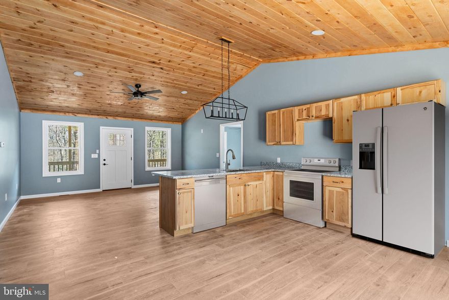 Tucked among the trees in Basye, this beautiful new construction will be ready for occupancy in the Spring. This ranch style home blends modern style with effortless one-level living in a peaceful community. The bright, open layout with vaulted ceilings creates an inviting flow between the spacious living area and kitchen— ideal for both relaxed evenings at home and gathering with friends. Contemporary finishes throughout give the home a clean, updated feel. The private primary suite offers its own tiled shower, while two additional bedrooms provide flexible space for guests, a home office, or hobbies. 

Enjoy a wooded setting with easy access to commuter routes, nearby amenities like fishing, hunting, boating and golf. Bryce ski resort just a short drive away — offering year-round outdoor recreation close to home. This would make a perfect vacation home!

This new construction is move-in-ready and delivers beauty, comfort and style all in one.