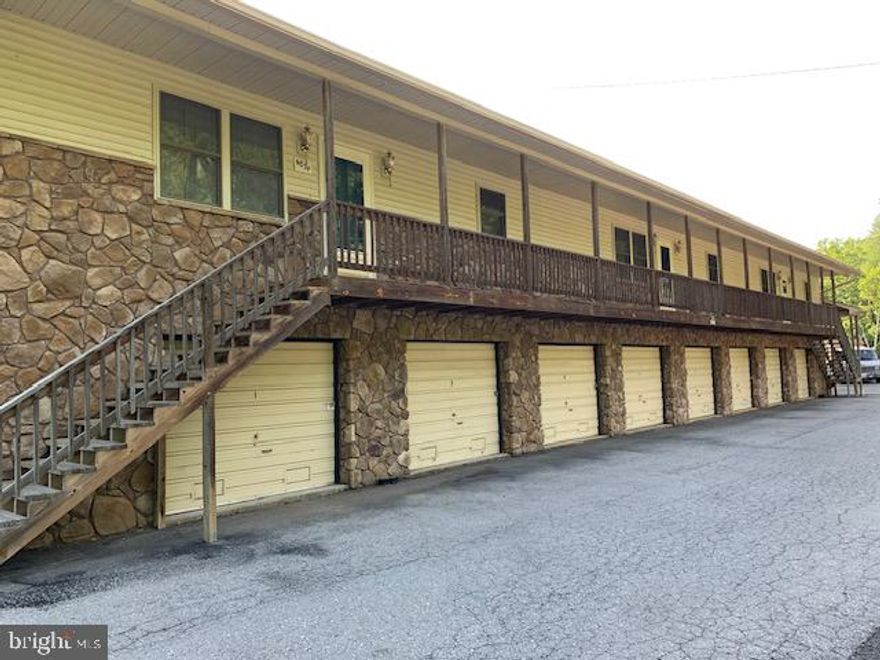 2.27 acres-includes the following:
15,467 sf one and two story mixed use building (1st floor-10,682 sf, 32 units, 72-552 sf range with office; 2nd floor-3 apts, 1987 sf, self storage-20 units 56-140 sf range)
6,696 sf two story mixed use building  (1st floor-8 units, 328-542 sf range; 2nd floor-3 apts)
1,957 sf self storage  (12 units, 45-218 sf range)
1379 sf self storage  (13 units, 60-144 sf range)
302 sf storage building
Two 176 sf moveable storage
120 sf moveable storage
Last heavy rains-No Flooding