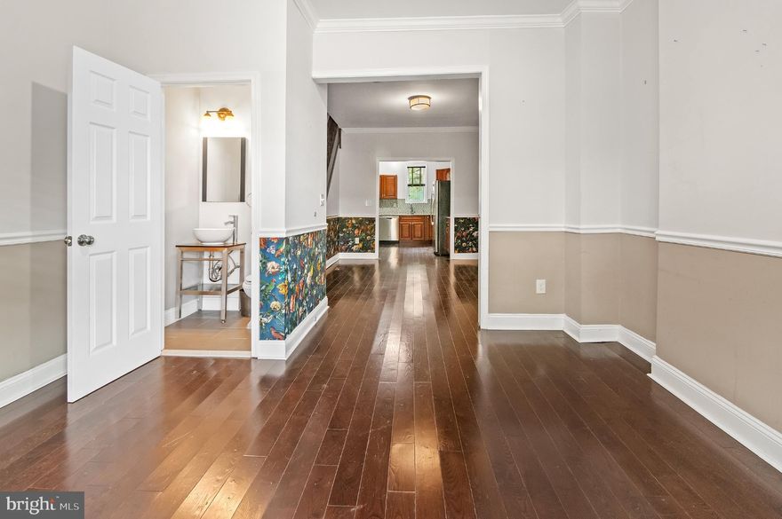 Welcome to 348 Whitridge Avenue — a beautifully refreshed rowhome that blends turn-of-the-century character with thoughtful modern updates. Nestled in Charles Village, one of Baltimore’s most colorful and connected communities, this home places you steps from leafy side streets, local coffee shops, and the creative pulse of the city.

Inside, classic details meet everyday comfort: refinished hardwood floors, fresh paint, and playful wallpaper accents that add personality without sacrificing elegance. The remodeled primary bathroom brings a spa-like touch, while the kitchen now features a new stove and microwave ready for your next dinner party.

Behind the scenes, the upgrades make living here easy — paid-off solar panels keep BGE bills low heading into the winter months, and the newly waterproofed basement adds peace of mind with plenty of storage or finishing potential.

Out back, the new privacy fence creates a cozy retreat — perfect for morning coffee, weekend grilling, or a small container garden.

Beyond your door, enjoy some of Baltimore’s best destinations within minutes: the Waverly Farmers Market, Peabody Heights Brewery, Union Craft Brewing, W.C. Harlan and Fadensonnen for a night out, The Book Thing for a weekend browse, and Wyman Park Dell for a quiet walk. Nearby cultural anchors include the Baltimore Museum of Art, Hopkins Homewood Campus, and The Rotunda’s mix of dining and movies. Quick access to I-83 and Penn Station makes commuting or weekend trips easy.

With its combination of energy-efficient upgrades, modern finishes, and unbeatable location, 348 Whitridge Avenue offers a welcoming, walkable lifestyle in one of the city’s most storied neighborhoods.