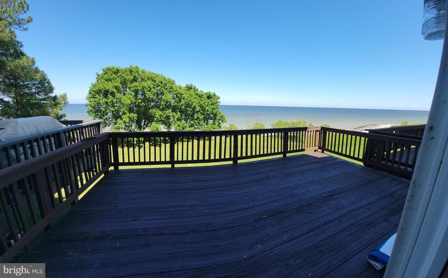 RELOCATING TO SOUTHERN MARYLAND? LOOKING FOR AN INVESTMENT? READY TO BUY BUT NOT READY TO MOVE YET? Excellent opportunity to own a townhome in the highly desirable Villas on Waters Edge. With one of the biggest Bay views in all of Cedar Cove, this 4-story home is ideal. The home is currently rented, and the lease transfers, so you'll have instant income. If you wish, you can continue to rent it as an investment property or move in later this year at lease end. Located just south of NAS Pax River and all the government contract companies, you are close to shopping, restaurants, entertainment, and more! Easy drive in and out. Step out the back door onto your patio and head out for direct access to the Chesapeake Bay! Turn left for private access to the Cedar Cove beach area, or head south for private access to the Villages beach area. Walk the beach, search for sea glass, shells, and sharks' teeth, swim, build sandcastles, and enjoy the beautiful Bay! The main level features an open concept with a large area that can be used as a living room or split into separate living and dining spaces plus a half bath for guests. Just past the kitchen, step down to another large area that has room for an office/sitting/reading/play area as well as a breakfast area or game table. Step through the sliders onto the large deck overlooking the Bay. Upstairs are 2 bedrooms and a hall bath as well as the primary suite. Primary features cathedral ceilings, ensuite with large soaking tub and separate shower, 2 closets, a loft that can serve as an office/study, and a wall of windows to enjoy the views. Wake up wih the sunrise and sleep with views of the stars! The basement has a family room, another 1/2 bath, large laundry room, and access to the 1 car garage. To tie this up with a bow, roof 6 yrs old, (was replaced with a 50-year roof with hurricane ties, ice shield, and more), HVAC 2 yrs old, laminate flooring 3 years old, stove and dishwasher 2 years old, HVAC 2 years old, and commercial water heater with booster 2 years old. Contact listing agent for more details about this great opportunity!