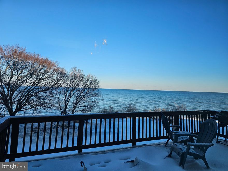 RELOCATING TO SOUTHERN MARYLAND? LOOKING FOR AN INVESTMENT? READY TO BUY BUT NOT READY TO MOVE YET? Excellent opportunity to own a townhome in the highly desirable Villas on Waters Edge. With one of the biggest Bay views in all of Cedar Cove, this 4-story home is ideal. The home is currently rented, and the lease transfers, so you'll have instant income. If you wish, you can continue to rent it as an investment property or move in later this year at lease end. Located just south of NAS Pax River and all the government contract companies, you are close to shopping, restaurants, entertainment, and more! Easy drive in and out. Step out the back door onto your patio and head out for direct access to the Chesapeake Bay! Turn left for private access to the Cedar Cove beach area, or head south for private access to the Villages beach area. Walk the beach, search for sea glass, shells, and sharks' teeth, swim, build sandcastles, and enjoy the beautiful Bay! The main level features an open concept with a large area that can be used as a living room or split into separate living and dining spaces plus a half bath for guests. Just past the kitchen, step down to another large area that has room for an office/sitting/reading/play area as well as a breakfast area or game table. Step through the sliders onto the large deck overlooking the Bay. Upstairs are 2 bedrooms and a hall bath as well as the primary suite. Primary features cathedral ceilings, ensuite with large soaking tub and separate shower, 2 closets, a loft that can serve as an office/study, and a wall of windows to enjoy the views. Wake up wih the sunrise and sleep with views of the stars! The basement has a family room, another 1/2 bath, large laundry room, and access to the 1 car garage. To tie this up with a bow, roof 2 yrs old, (was replaced with a 50-year roof), HVAC 2 yrs old, laminate flooring 3 years old, stove and dishwasher 2 years old, HVAC 2 years old, and commercial water heater with booster 2 years old. Contact listing agent for more details about this great opportunity!