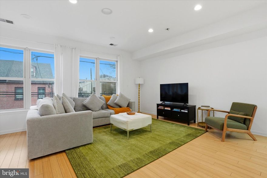 Legally zoned and successfully run as an Airbnb, 1011 N Orianna Street presents a rare opportunity to own an exceptionally large new-build from 2009, offering over 5,000 square feet of living space with extraordinary flexibility. Configured with 8 bedrooms and 5.5 bathrooms, the home features multiple living areas, two full kitchens, and a lower-level kitchenette, creating an ideal setup for intergenerational living, large households seeking privacy within a shared home, or buyers looking to continue operating a high-performing short-term rental investment that is on Airbnb and VRBO. The thoughtful layout allows the property to function almost like several homes under one roof. The main level includes a spacious kitchen, living and dining areas, two bedrooms, and access to a rear deck and shared patio. The finished lower level provides additional living space with a kitchenette, two bedrooms, a full bathroom, and direct patio access. The second floor offers another kitchen, multiple living areas, a dining space, and a half bath, while the upper level contains four additional bedrooms, including a primary suite with an ensuite bath, plus convenient second-floor laundry. Multiple gathering areas and kitchens allow residents or guests to spread out comfortably while still enjoying shared spaces. Just steps from the vibrant restaurants, cafés, parks, and boutiques that define Northern Liberties, the home offers easy access to Old City, Center City, and major cultural destinations, including the Philadelphia Museum of Art and The Franklin Institute. With its scale, flexible layout, and prime location in one of Philadelphia’s most dynamic neighborhoods, 1011 N Orianna Street represents a unique opportunity for both homeowners and investors alike. Airbnb furnishings are negotiable. Available for immediate purchase; occupancy is subject to confirmed bookings at the time of the offer.