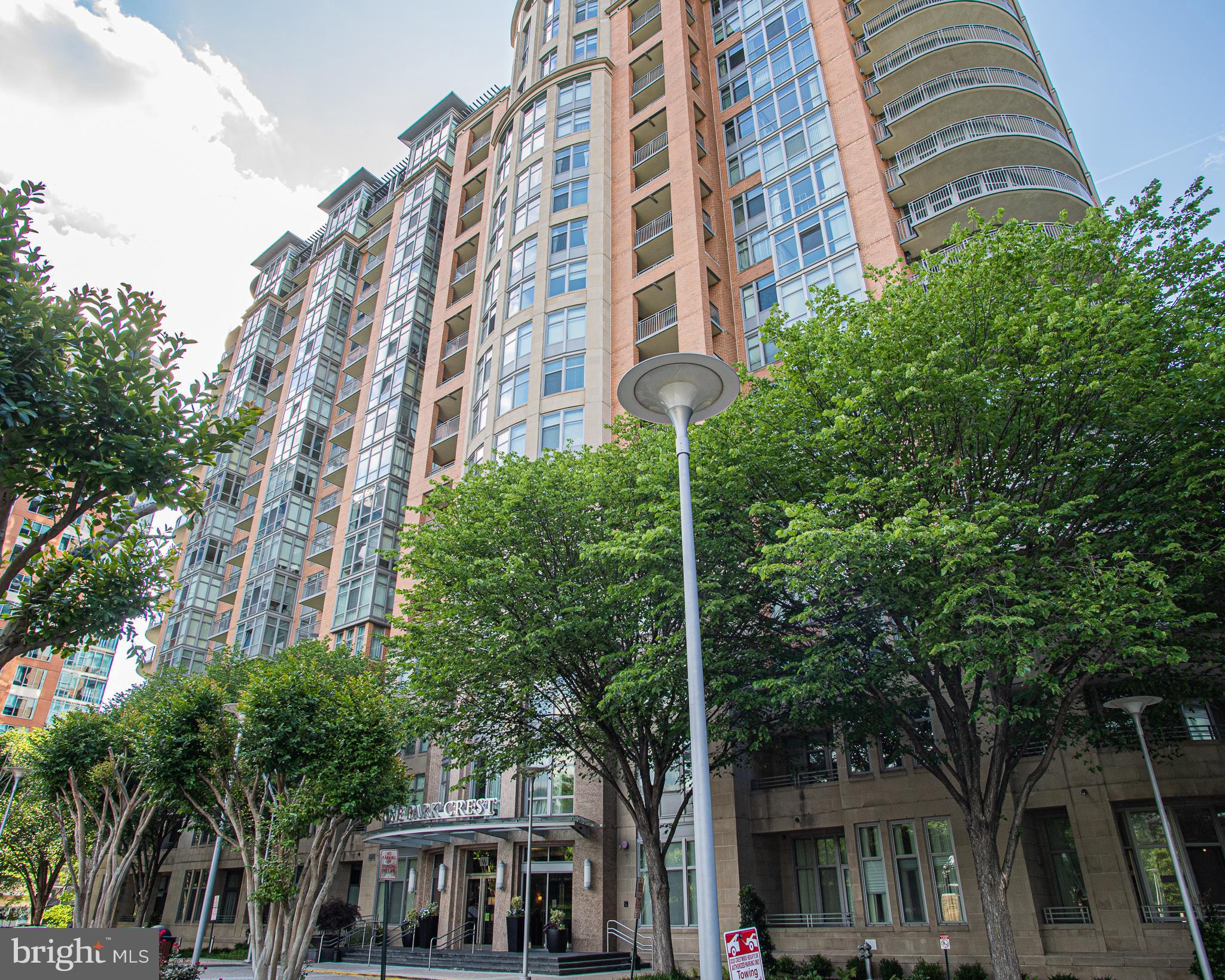This spacious and modern 2bed/2bath condo is located on the 16th floor of a stunning high-rise building. The unit features floor-to-ceiling windows in the living room, offering southern exposure and beautiful natural light throughout the day. The open living, dining, and kitchen area features hardwood floors and a modern kitchen with stainless steel appliances. Two dedicated parking spaces are included. Enjoy top-tier amenities including a resort-style pool, full gym, secure entry, and 24/7 concierge service. Located next to Harris Teeter and just minutes from restaurants, Tysons Corner malls, Metro stations, major bus routes, and highways, this condo offers unmatched convenience for commuting and everyday living.