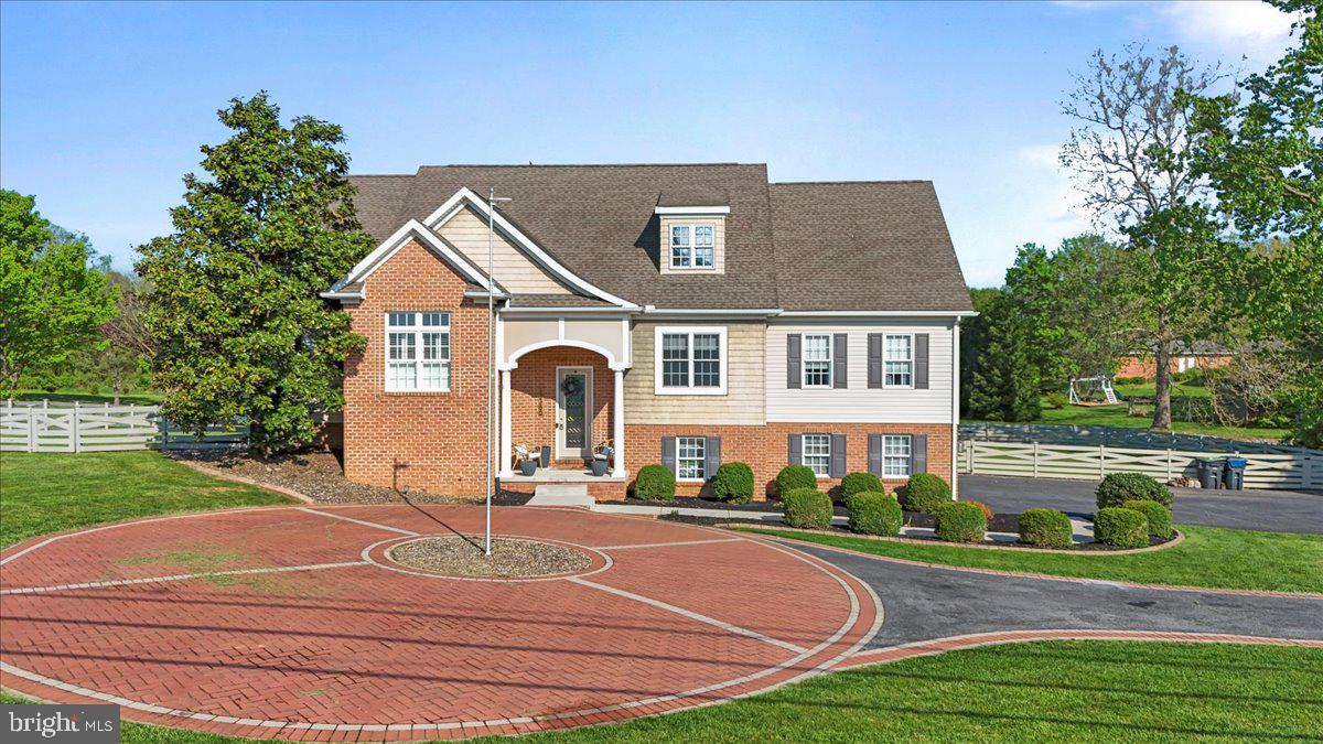 Don’t miss this opportunity to own your own slice of heaven; featuring a huge lot with beautiful views, a stream, and a custom built home with an open floor plan!  Located in scenic Greencastle with convenient access to 81, and only minutes from Hagerstown. Upon arrival, you’ll notice the large back yard with breathtaking sunsets, plenty of outdoor entertaining space with a fenced in yard, a huge patio, and a covered back porch. A custom circular driveway adds additional curb appeal and functionality out front, with plenty of parking and a two car side loading garage. Step inside to a spacious and welcoming foyer and a large great room with new LVP wide plank flooring, a custom accent wall and floating shelves to add to the charm. From there, step into the large kitchen with beautiful custom cabinetry, updated appliances, and a breakfast nook with plenty of natural light. This home offers an oversized master bedroom with plenty of windows and natural lighting, high ceilings, and brand new LVP flooring; accompanied by a large on suite with his and hers walk in closets, a tile shower, and a large soaking tub.  Furthermore, enjoy three additional large bedrooms and a second oversized full bath. Downstairs you’ll find a large media room with built in speakers, a projector and a large screen perfect for family movie nights!  Also enjoy the oversized laundry room/ kitchenette, a half bath, and ample amounts of storage. This home is move in ready with plenty of upgrades you’ll want to see for yourself! Call Alice for a showing today!