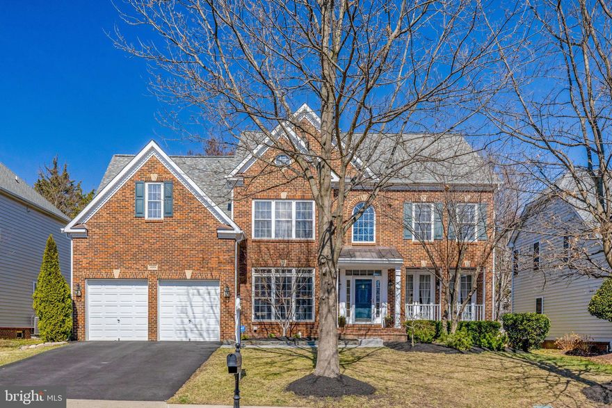 OPEN HOUSE SUNDAY 3/16/ 2-4
Have it all! Fabulous Winchester Benfield model will not disappoint. Tall trees and smooth lawns beautifully maintained (featuring sprinkler system) are a fitting introduction to this brick front colonial in popular Brambleton. Space abounds through out with high/vaulted ceilings and grand size rooms. 2 story foyer entry invites you in to this ideal home. French doors lead to library/home office. Formal living room features hardwood floors, crown molding, and French doors to cozy front porch. Banquet size dining room perfect for entertaining lots of family and guests with crown molding, chair rail, wainscoting, and hardwood floors. A chefs dream kitchen with abundant cream color cabinets, new quartz counter tops, stainless appliances, tile backsplash, recessed lighting, double oven, pantry, massive island with gas cook top and seating, coffee/wine bar, table space, and walk out to deck. Soaring ceilings in family room off kitchen with stone to ceiling gas fireplace, wall of windows, and back staircase to upper level. Double door entry to perfect primary suite with vaulted ceilings, sitting room, his and her walk in closets, and in suite bath with his and her vanities, soaking tub, separate shower, water closet and linen closet. 2nd bedroom with in suite bath, and 2 additional bedrooms share Jack and Jill bath. Enjoy more living space in the lower level with huge L shape recroom,, plumbed for wet bar, and double door walk up to rear yard. Den and full bath perfect for extra guests/au pair etc. Finishing the lower level enjoy this fabulous storage room. Step outside from the kitchen and enjoy a private tree buffered rear fenced yard with spacious deck and steps down to fabulous patio (both new in 2022) surrounded by lush lawns, flowering shrubs, and perennials. All newer carpeting, fresh paint in many areas, roof and wall ovens 2019, gas cooktop 2020, refrigerator 2023, dishwasher 2018, Upper level furnace 2016, lower level furnace serviced and working great, HWH 2024. Oh my and if that is not enough this home is in Brambleton- rich in amenities through out with pools, tot lots, tennis courts, volley ball, miles of walking trails, and so much more. Close by the Town Center at Brambleton has something for everyone with a plethora of retail stores, grocery store, movie theater, fitness, restaurants, entertainment, businesses, commercial and doctor offices, summer concerts, farmers market and other great events. For the commuter you are 4 miles to the Silver Line Metro, and there's a commuter bus stop within walking distance from the house. You have easy access to the Dulles Greenway, Loudoun County Parkway, Rt's 50, 28, 15, and 7.